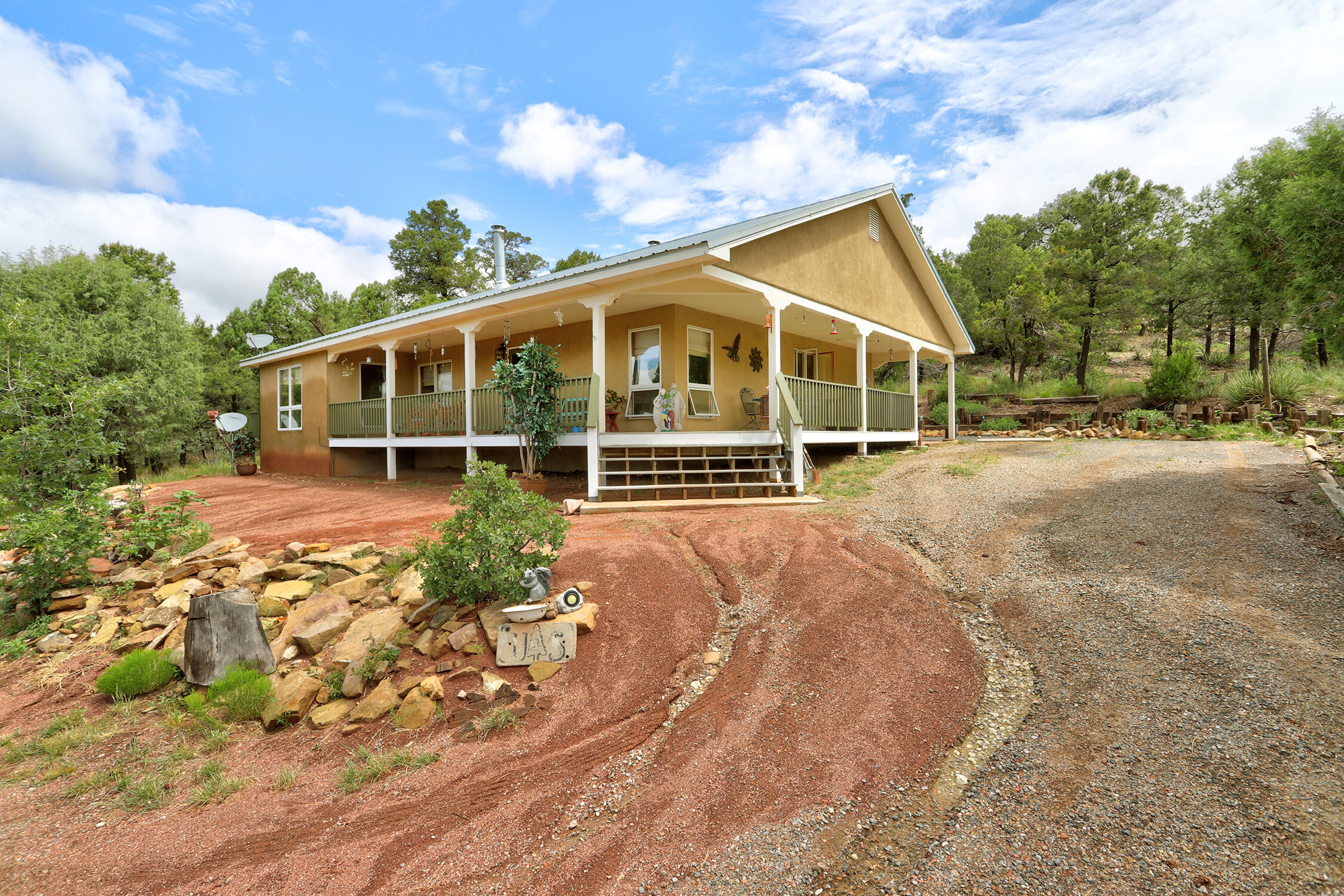 OPEN HOUSE SUNDAY 6/29 1-3Escape to peace on 5 ACRES of tranquility in this charming 2 bed/2 bath mountain home, nestled among towering pines and breathtaking vistas. Exquisite weekend getaway or a year-round sanctuary, this property offers the perfect blend of comfort and nature. Step inside to find a warm, open-concept living area, vaulted ceilings, and large windows that flood the space with natural light. Both bedrooms are generously sized, with the primary suite offering a private bath and serene view's of the surrounding forest. Step outside onto the wraparound deck to sip your coffee while taking in panoramic mountain scenery or watch the stars come out at night. Don't miss this rare opportunity to own your own piece of mountain paradise today! Schedule your private showing today