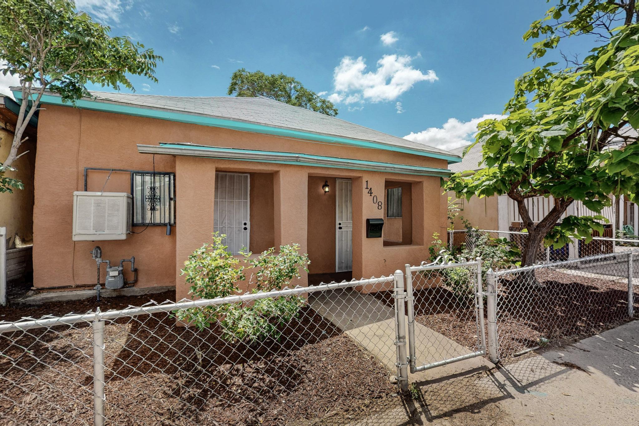 Two bedroom 1 full bath adobe home is Barelas neighborhood. New stucco, fresh paint, New granite counter tops, New cabinets and New kitchen appliances! Tile floors throughout. Large back yard with alley access for off street parking. Close to the Rail Yards Market, Hispanic cultural center, Zoo, coffee shops and breweries.