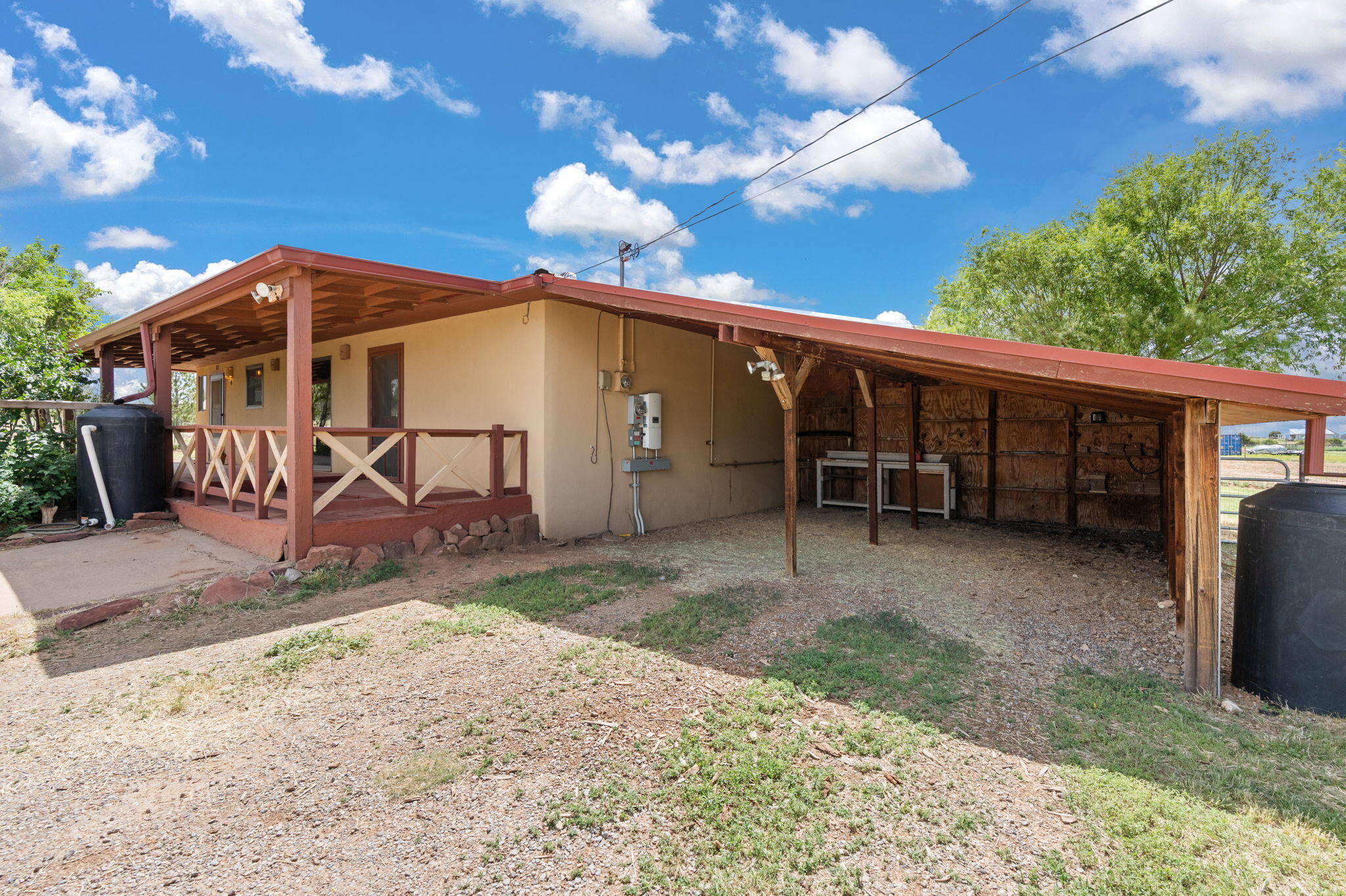 Welcome Home to this Gorgeous Horse Property with some of the most Stunning views you will ever see! This 2/3 bedroom, 2 Full bath home has so much to offer! Possible 3rd bedroom, office, shop, home gym, studio has separate entrance. No Carpet! There is new fencing, new gate, new woodstove, new vinyl flooring and newer kitchen appliances! Furnace was new in 2022. 6 rain catch containers for a total of 2,145 gals. Covered front and back porches on this corner lot! Owned solar panels to offset electric costs. Solar is free standing, not on the roof!!! This is a must see home! Schedule today to see this Amazing Mountain Property! This is a great place to call home!