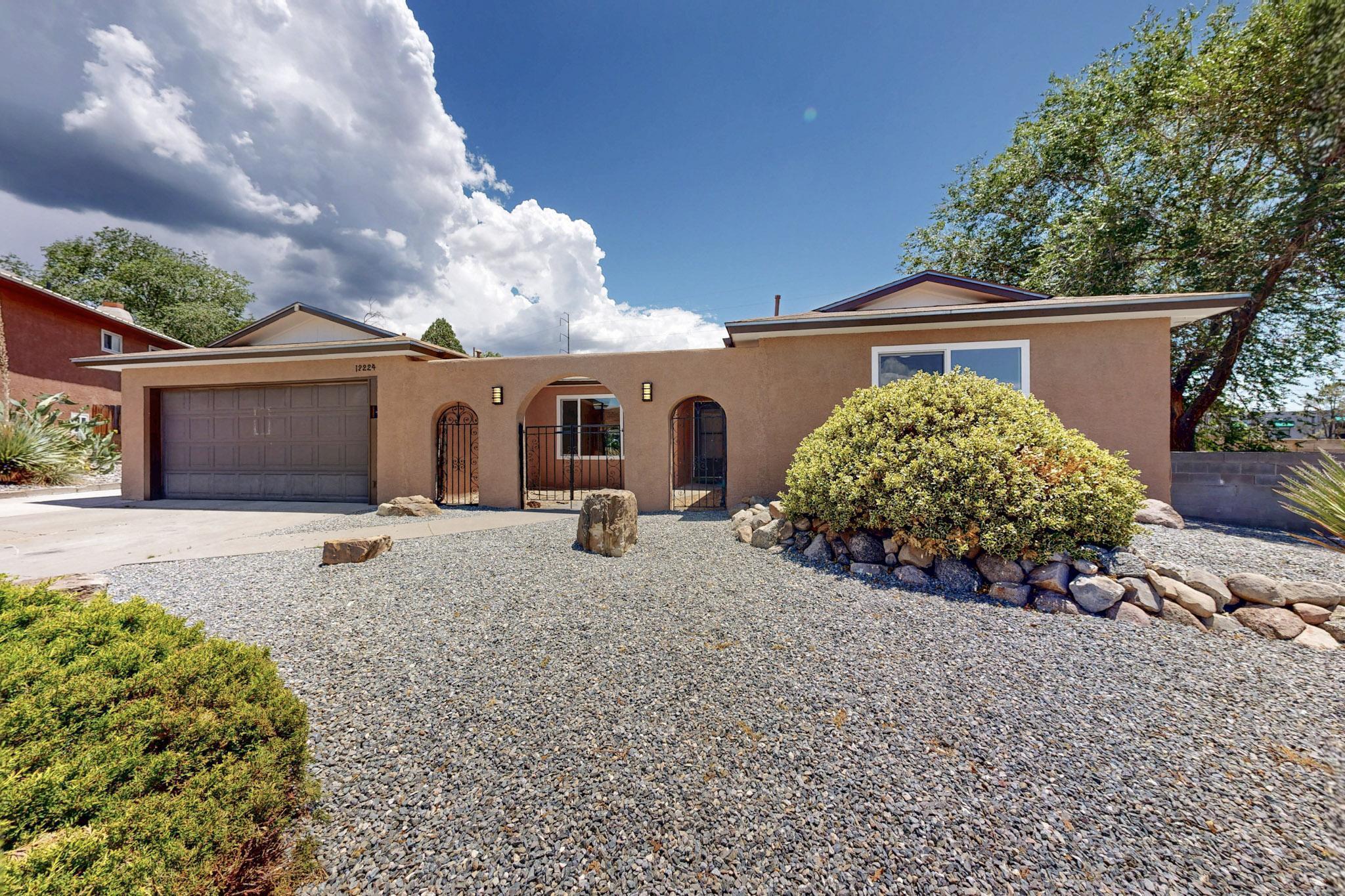Welcome to this beautifully renovated home in a great NE Heights location. Just renovated, new flooring throughout, fresh paint, new kitchen, stainless appliances, upgraded bathrooms, new windows, roof with 1year warranty, new HVAC with refrigerated AC. Covered patio, views of the Sandias. Great location, close to great schools, shopping and dining. Come see this move-in ready home today.