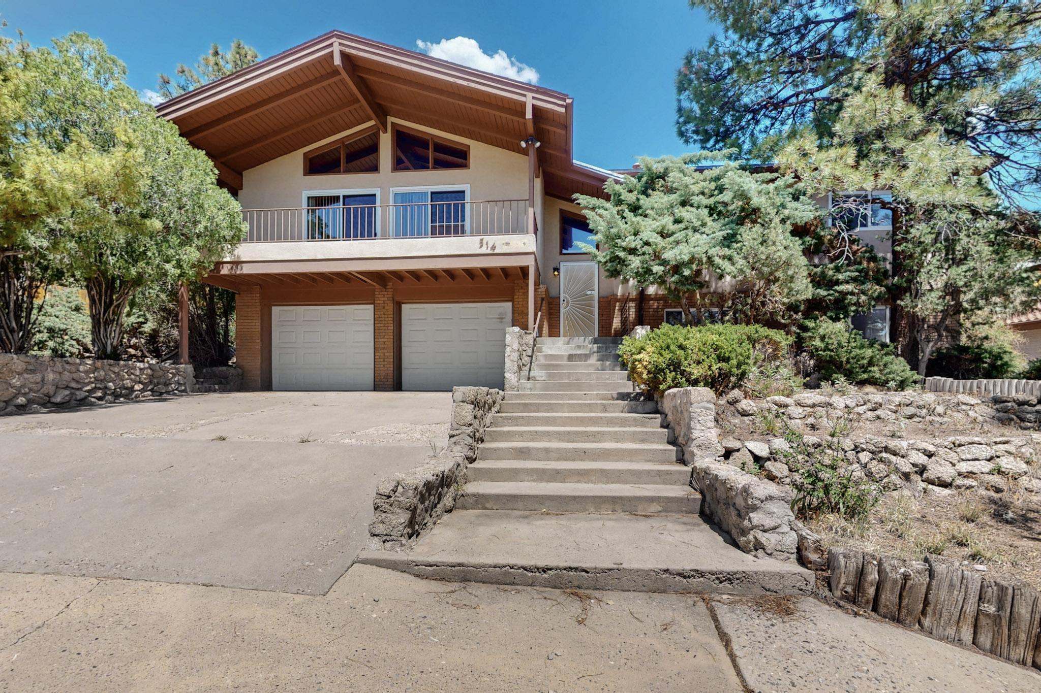 Opportunity in the Foothills - Supper Rock Beauty w/ views & potential.  Desirable Supper Rock neighborhood proximate to both scenic trails and I-40, this 4BR, 3BA home is full of charm and potential.  Interior wood beams warm the living space, complimented by original parquet floors, updated windows and refrigerated air.  A smart floorplan features 3 upstairs bedrooms, basement living room with a fourth bedroom and bath- perfect for guests or teens.  Great views and solid bones make this a fantastic opportunity for a growing family ready to add sweat equity.  Bring your vision and make it shine!