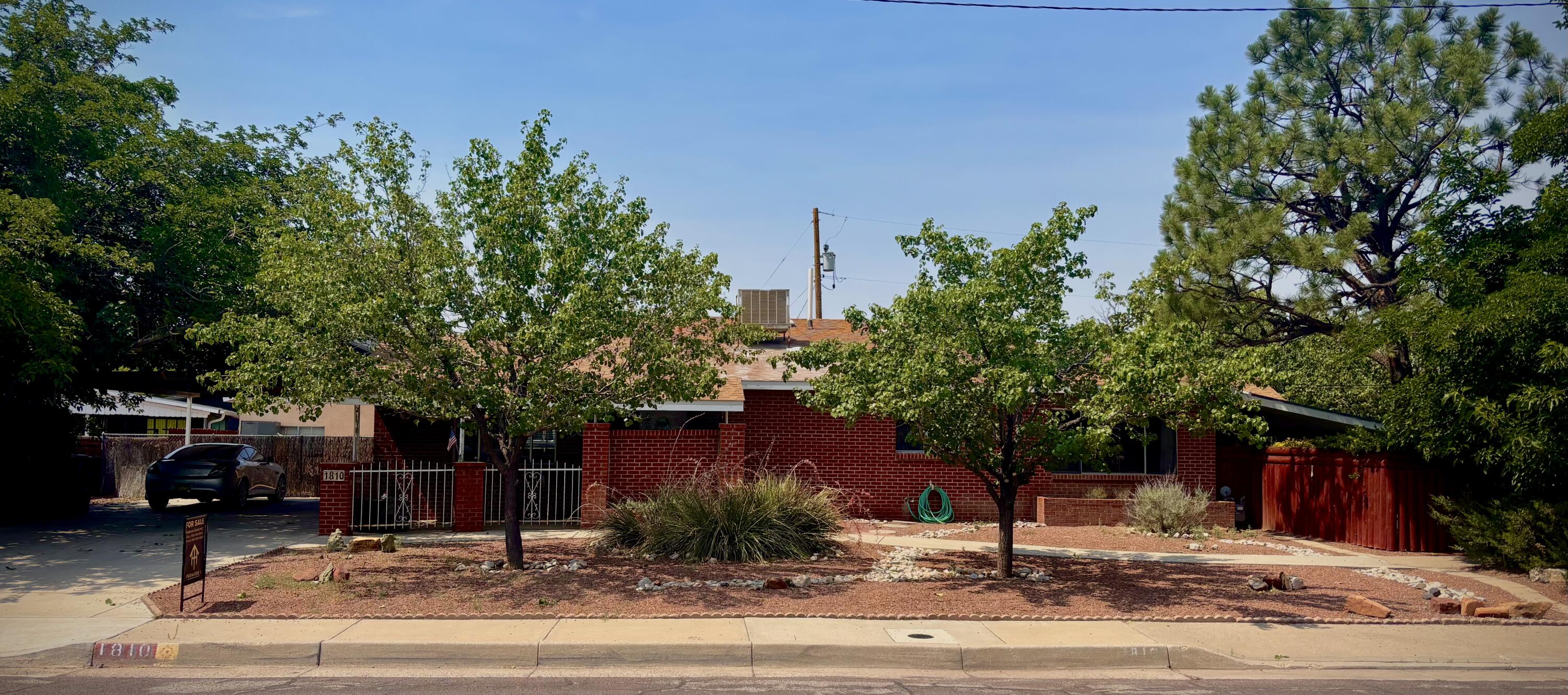 Charming North Valley Gem with Detached Studio Space! Welcome to 1810 Miller Circle NW, Albuquerque, NM 87107 -- a beautifully maintained 3-bedroom, 2-bathroom home offering 2,129 sq ft of spacious living on a generous 0.25-acre lot, nestled in the heart of the desirable North Valley. Inside, you'll find warm, welcoming living spaces filled with natural light, and a flexible floor plan. This unique property features: A detached ~480 sq. ft workshop which could be ideal for mother-in-law quarters / casita. Perfect for a home office, or creative space. Two-car carport for easy covered parking. Large, private lot with mature trees and space to garden or entertain. Quiet, established neighborhood.  (the workshop is NOT included in the overall square footage)