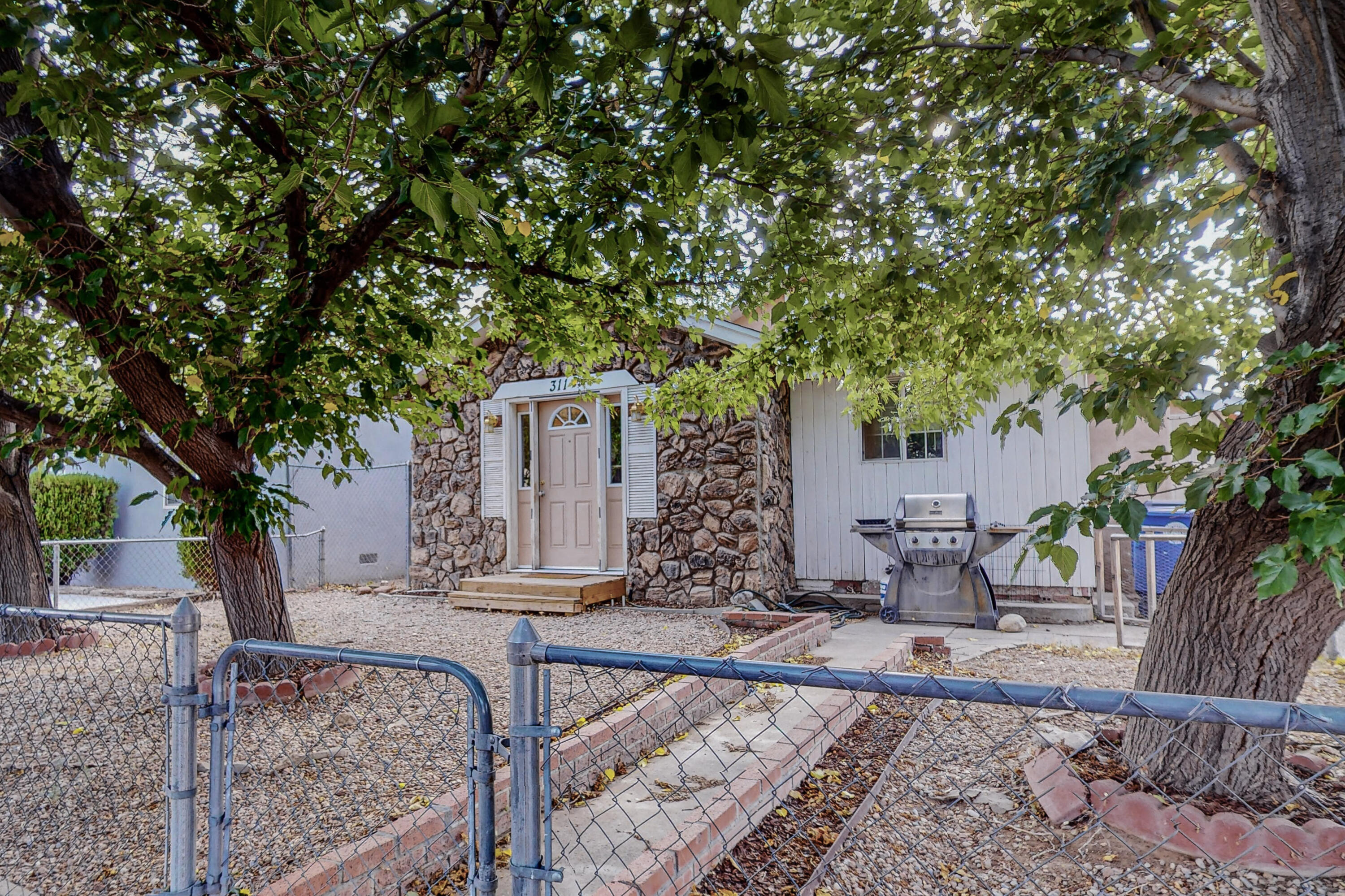 Nice triplex by UNM.  Two units are attached and the third unit is a detached unit at the back of the property.  Units A is 2BR1BTH 1010 Square Ft with it's own washer/dryer.  Unit B is 2BR/1BTH 793 Square Feet.  The detached Unit C is 3BR/1BTH 877 Square Feet.  Current rents total $3440, with room for improvement.  Units are all occupied, please do not disturb the occupants.