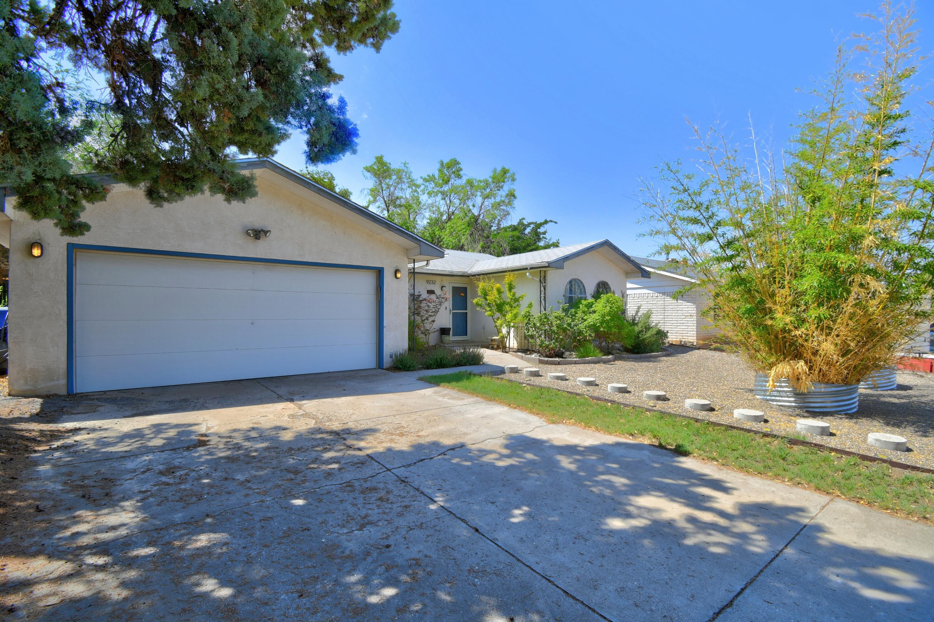 Just Listed!  Immaculate, affordable and adorable NE Heights gem with mature gardens, trees, and backyard oasis. Architect owned and updated, several improvements in kitchen: tile backsplash, cabinetry, concrete countertops, Stainless. 2-living areas with custom shelving, new flooring, hand-carved wooden mantle on fireplace conveys, with matching coffee table. dining/living/office combination: unique functional floorplan. Sliding doors to fully enclosed backyard park-like atmosphere, landscaping. Front  and side yards fully landscaped with outstanding curb appeal. A must see storybook home.