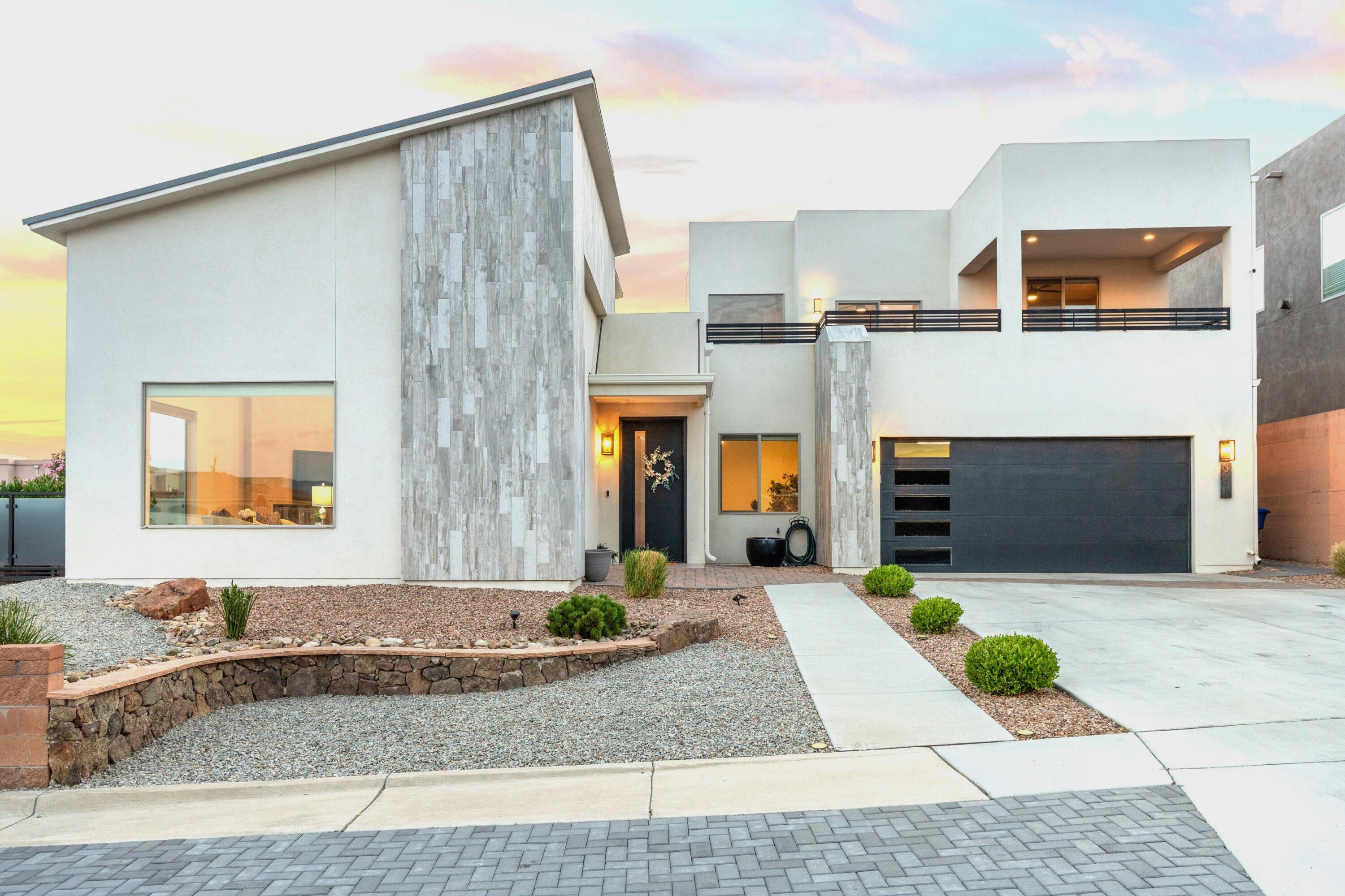Perched on an elevated corner lot in the coveted Knolls of Paradise, this modern, custom-built home blends elegant, contemporary design w/ daily comfort! The gourmet kitchen w/ eat-in island/breakfast bar, stainless appliances, soft-close cabinetry & nice pantry. The interior boasts a modern fireplace, oversized picture windows, Hunter Douglas Silhouette blinds throughout & cove-lighting in the raised, coffered ceilings! TPO & metal roofs, tankless H2O heater & full-house water filtration system! Spacious main level primary w/ 2 private exterior access points, the primary bathroom has double sinks, makeup vanity, jetted tub, pass-through shower & a generously sized walk-in closet! Great loft area opens to an incredible view deck. Custom iron gates & privacy toppers, open patio spaces, low