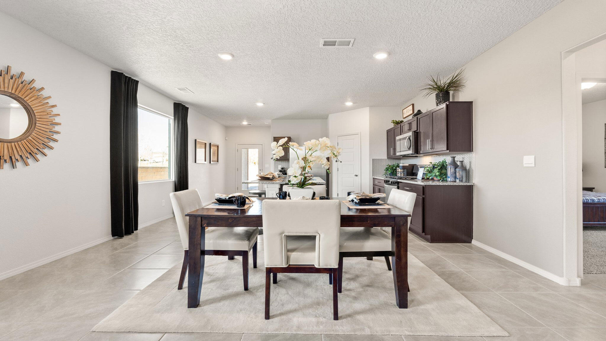 Discover comfort and convenience in The Sawyer, a beautifully crafted 1,600 sq. ft. home featuring 4 spacious bedrooms and 2 bathrooms. Located in a desirable Los Lunas neighborhood with quick and easy access to the interstate, this home perfectly balances peaceful living with commuter convenience.Enjoy cooking and entertaining in a modern kitchen with sleek stainless steel appliances, seamlessly connected to a bright and open living space. A durable tile roof adds long-lasting charm and protection, while the covered patio area offers the perfect spot to relax or host gatherings outdoors year-round.Whether you're a growing family or simply looking for space to spread out, The Sawyer offers the functionality and style you need  all in a location that puts everything within reach.