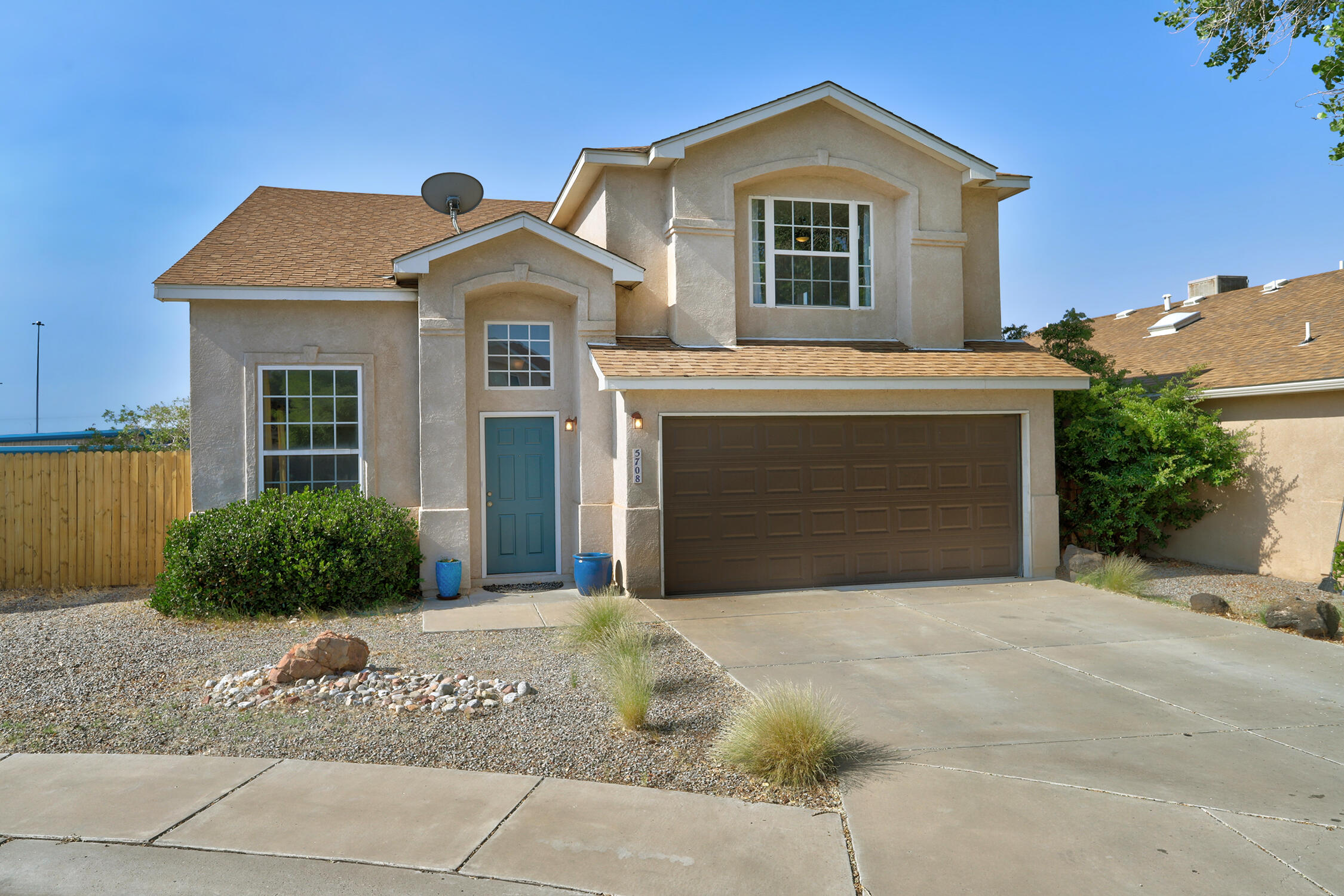 This sweet home is move-in ready! The location is the best of both worlds: super convenient to get anywhere in town from Coors and I-40, but on a quiet, peaceful cul de sac. No carpet, all floors are either tile or pretty laminate plank. Fresh paint, stainless steel appliances, and a fantastic backyard with a new pergola and wood fence. Downstairs you'll find cathedral ceilings, a bonus room off the kitchen for an office or storage, a half bathroom, and plenty of dining space. Upstairs, the roomy primary suite has a large walk in closet and dual sinks. A hall bath and two more bedrooms complete the second floor. Clean and tidy, washer/dryer convey with acceptable offer. Nice two car garage. Come see it today, you will not be disappointed!