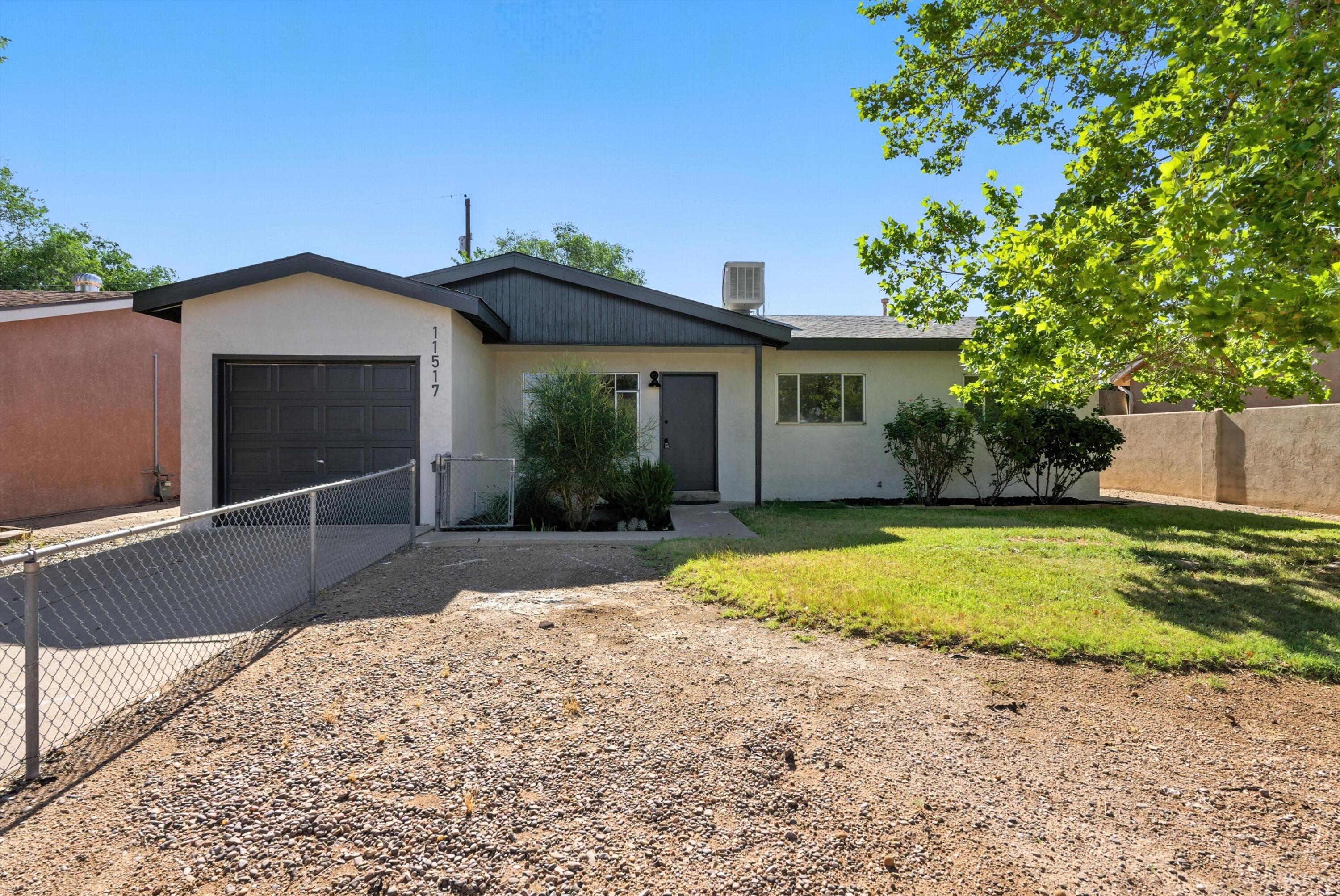 BEAUTIFULLY UPDATED AND FLOODED WITH LIGHT, THIS NORTHEAST HEIGHTS GEM INVITES YOU TO RELAX AND STAY AWHILE. The open floorplan flows from the welcoming living room to the dining area just off the kitchen, all grounded in stylish modern flooring. A picture window lets the New Mexico sun pour in, while the lush backyard--with its walled privacy, vibrant plantings, and covered porch--offers a serene retreat. The fenced front yard adds charm and function, while the updated exterior delivers standout curb appeal. Enjoy the best of classic style and location. Come see it today!