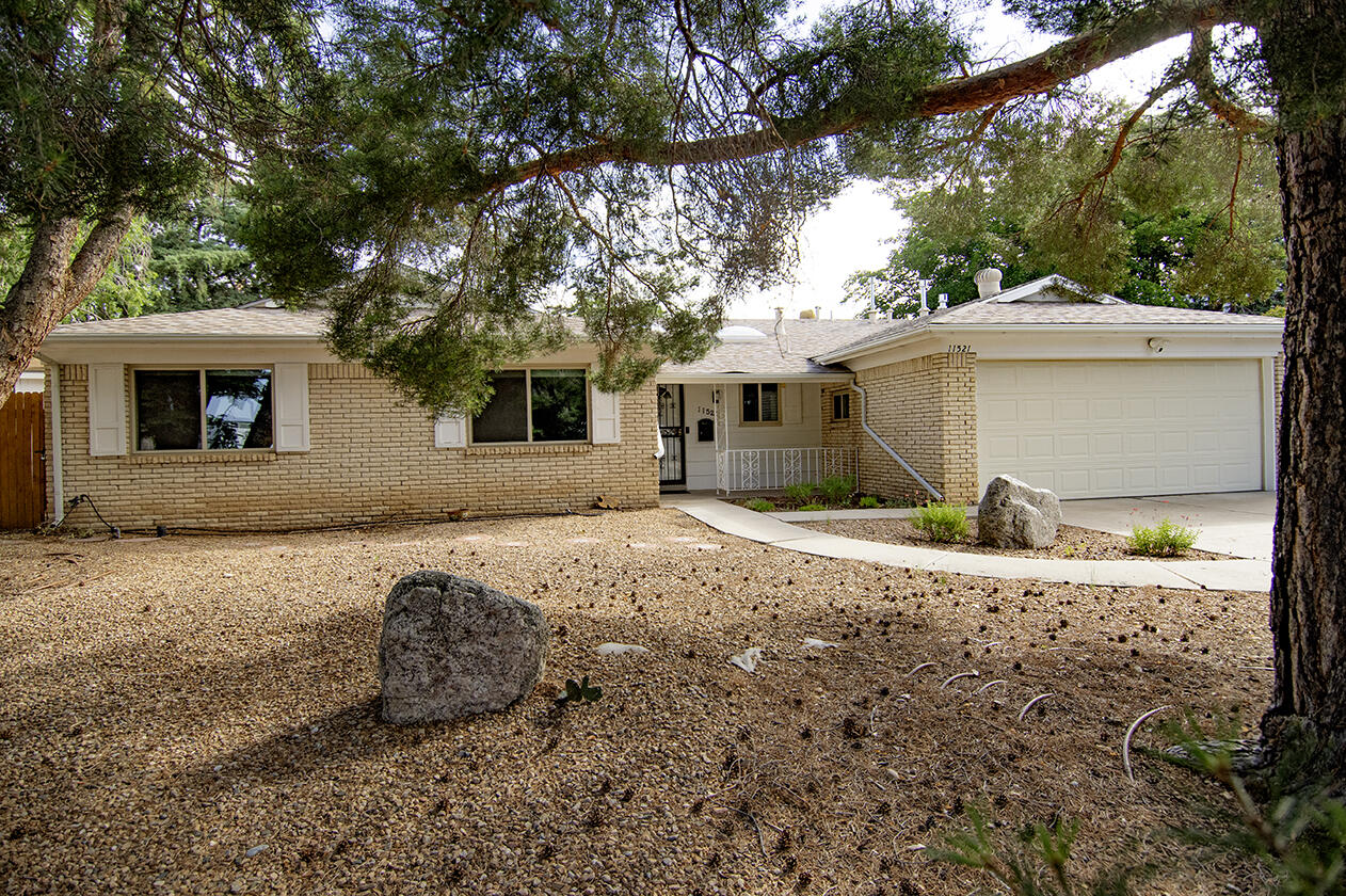 Welcome home to Holiday Park at its finest! On a prime cul-de-sac, this charmer has been remodeled and has quartz counters, stainless steel appliances, a modern primary en suite with walk in shower, granite counter top, and a walk in closet as well as side by side closets with a gas fireplace and separate entrance to the backyard and covered patio. Hall bath has jetted tub and floor plan has multiple living areas, a fireplace and beautiful sunroom that can be used as a living area, additional bedroom, game room, craft room or office.  Such versatility and all tucked into the Holiday Park neighborhood known for its proximity to Tramway and the foothills, nearby neighborhood parks, restaurants and shops. You'll be sad if you don't