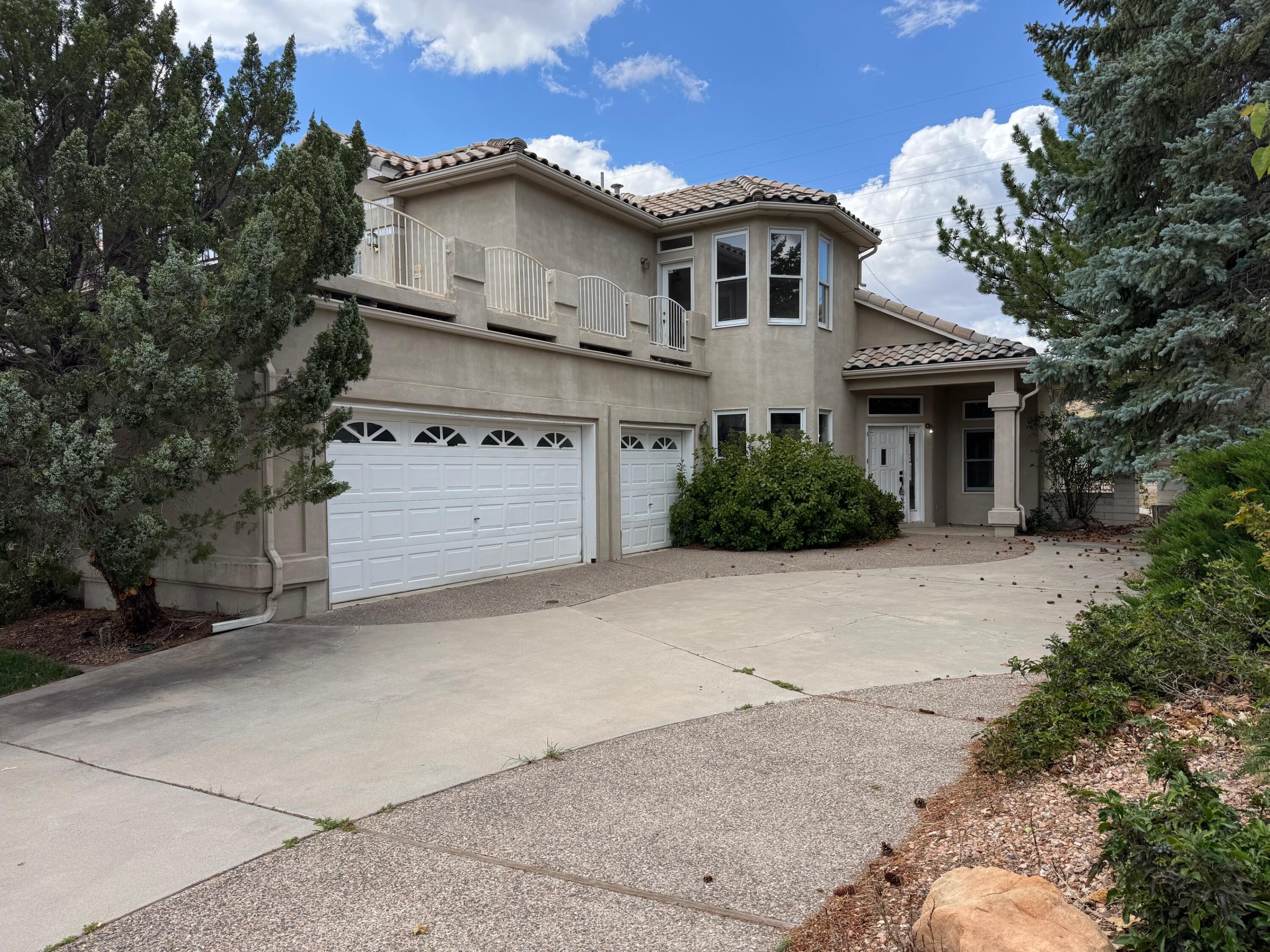 Located in Albuquerque's premier neighborhood. The coveted Tanoan Community and steps away from the beautiful golf course. Get in 9 holes before or after work and 18 on the weekend! No neighbors in the back for spectacular views of the Sandia Mountains! The house features an open floor plan. A spacious master bedroom with a walk out deck and views of the lush green golf course while sipping your favorite cold drink. Downstairs features an office or bedroom and a guest bathroom. Two different patios, one off the living room and the other off the dining room. The house needs work. It could be an opportunity for sweat equity. The square footage is estimated. Please have it measured to your satisfaction.