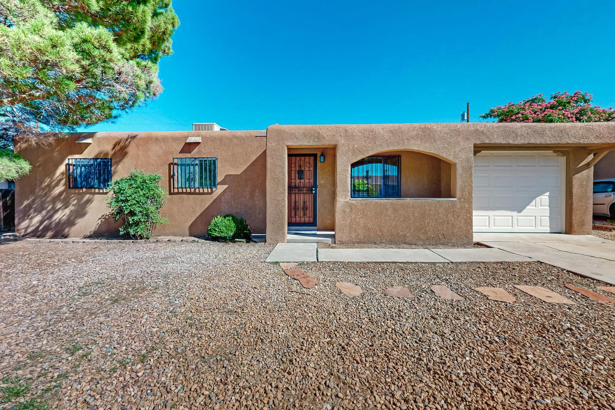 OPEN HOUSE - Friday, July 11 and 12, 11-1:00 p.m. Charming Mid-Century Gem in the Northeast Heights. Step into this beautifully updated 1958 home in the heart of the Northeast Heights. Blending classic Albuquerque charm with modern upgrades, this move-in-ready property offers comfort, style, and convenience. Recent improvements include new electrical system, fresh interior paint, updated flooring and brand-new appliances. The refreshed patio extends your living space outdoors, making it perfect for hosting guests or enjoying a quiet evening within the walled backyard. Nestled in a well-established neighborhood, this home combines timeless character with today's essentials.