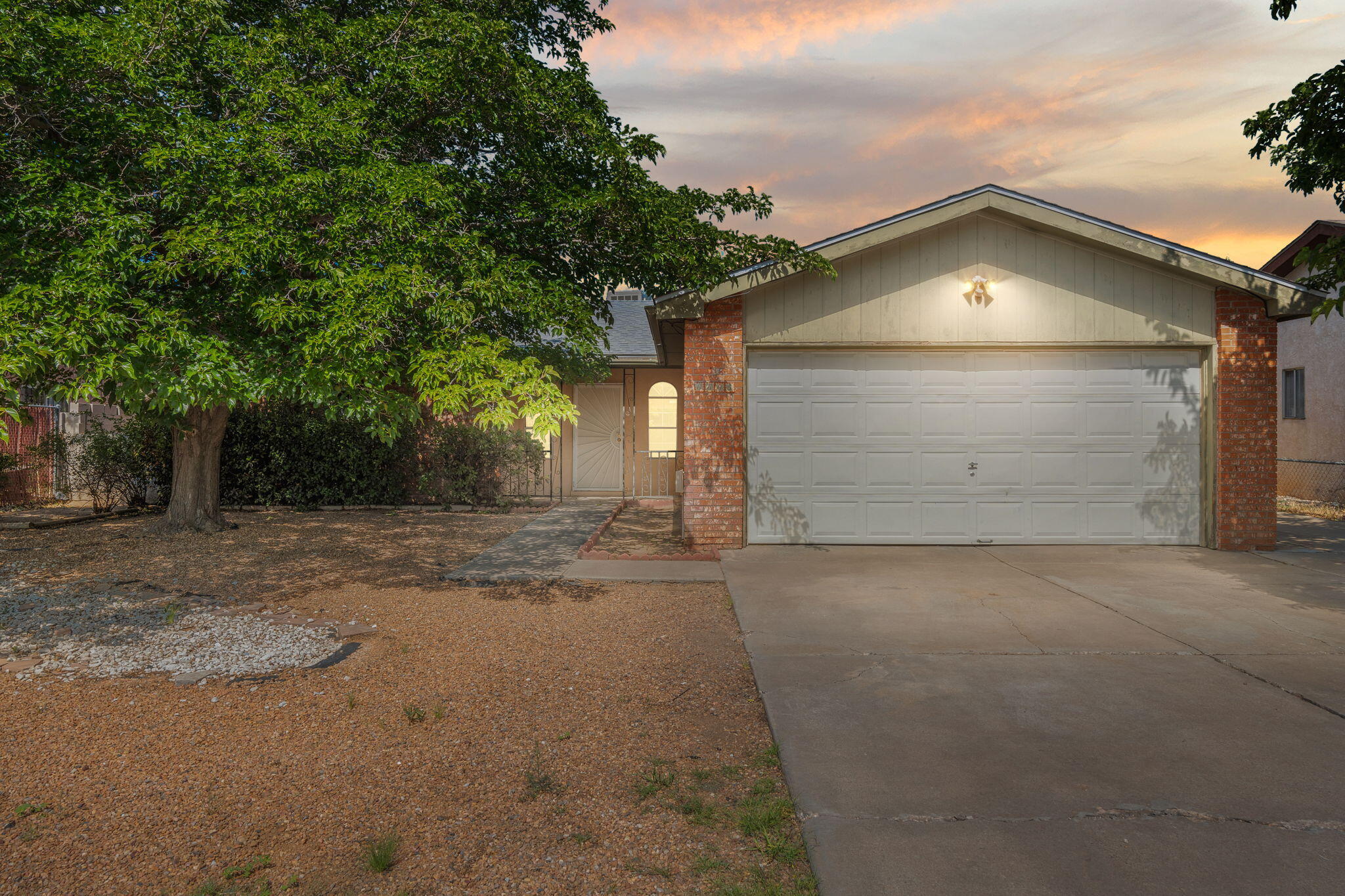 Located in a desirable NE Heights community, this charming single family home features 3 bedrooms, 2 bathrooms, and a bright, open enclosed sun room ideal for year round enjoyment. The property backs to open space with no direct neighbors behind, offering added privacy.A two-car garage plus additional side parking makes it perfect for extra vehicles, trailers, or outdoor toys. Conveniently located just off I&#8209;25, you're only minutes from major freeways, top-rated restaurants, parks, and shopping.Contact your broker today to schedule a private tour!