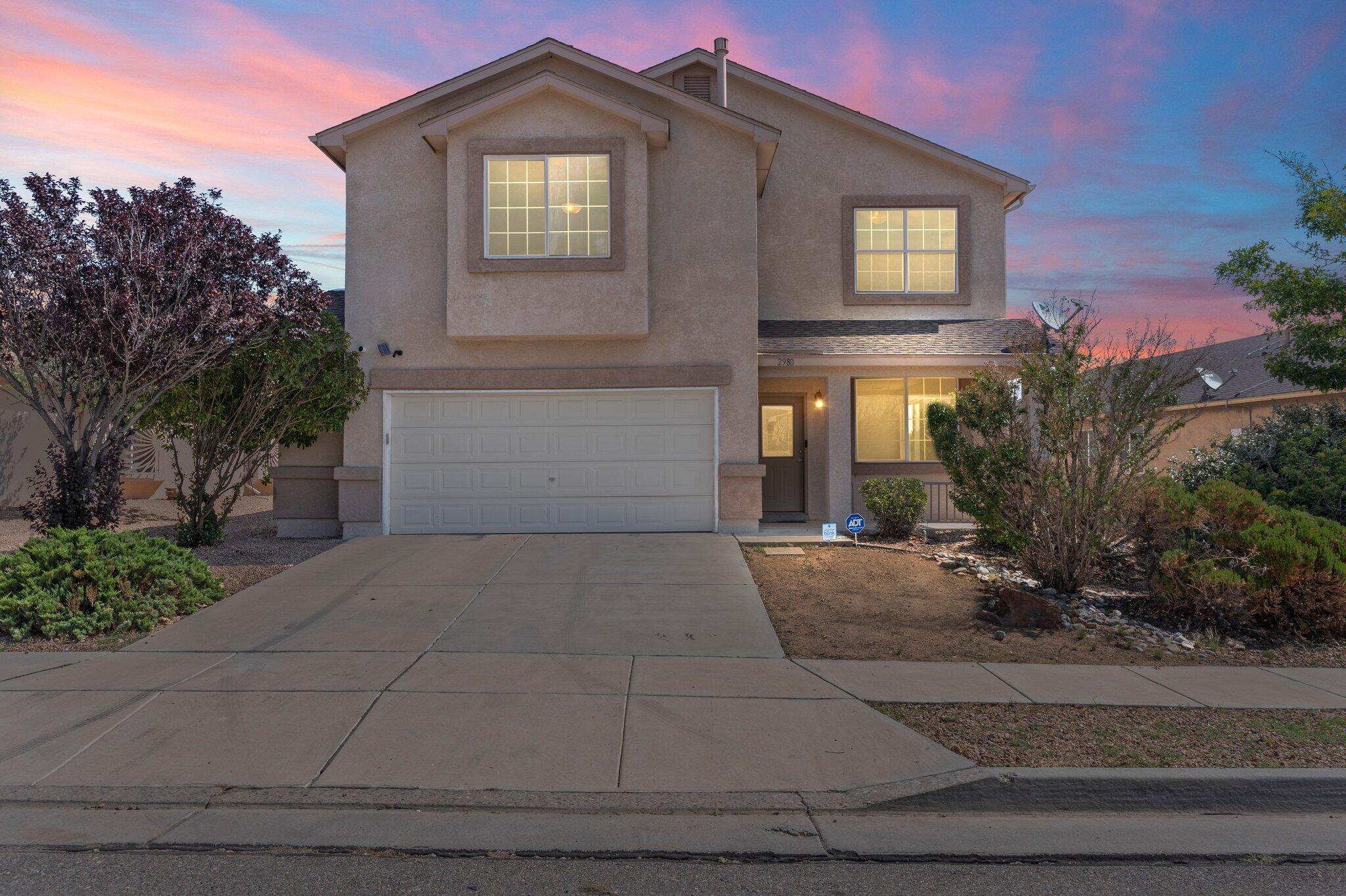 This beautifully designed two-story home offers the perfect blend of space, style, and comfort. From the welcoming covered front porch to the upstairs deck, every detail invites you to feel right at home. Tile and vinyl flooring flow through the main living areas, complementing a spacious kitchen with recessed lighting, a center island, appliances, and a bar area. Thoughtful touches like a built-in bookcase and decorative niche add both personality and function. Enjoy cozy evenings by the fireplace in the living room, or unwind in the primary suite with its own fireplace, ensuite bath featuring a double sink vanity, and a walk-in closet. Upstairs, a loft provides flexible space for a second living area. With inviting interiors and a peaceful outdoor setting, this home truly has it all!