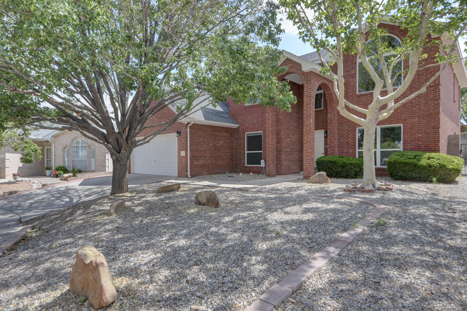 Stunning Home offers 70k+ in recent Modern Upgrades/Updates! Striking Travertine Stone feature wall & upgraded Contemporary Lighting greet you! Gorgeous Kitchen is the Heart of the Home w/ Beautiful Cabinetry/High-End Granite/Farm Sink! Formal Dining boasts Hardwood Floors/New Contemporary Chandelier! Versatile Floor Plan offers Multiple Living areas! Main Living area has Wood-Look Ceramic Tile/Custom Wall Trim! Flexible Space could be Art Studio/Office, now a 14K Home Gym! Owners Suite offers Views/Shadowbox Ceiling/Decorator Ceiling Fan! New Owners Bath w/Dual Floating Vanities/Garden Tub! Mountain Views from the Deck! 4 or 5 Bedroom/3.5-Bath in the Highly sought-after La Cueva school district! Walking distance to shopping/restaurants! 2 Refrigerated Air units!
