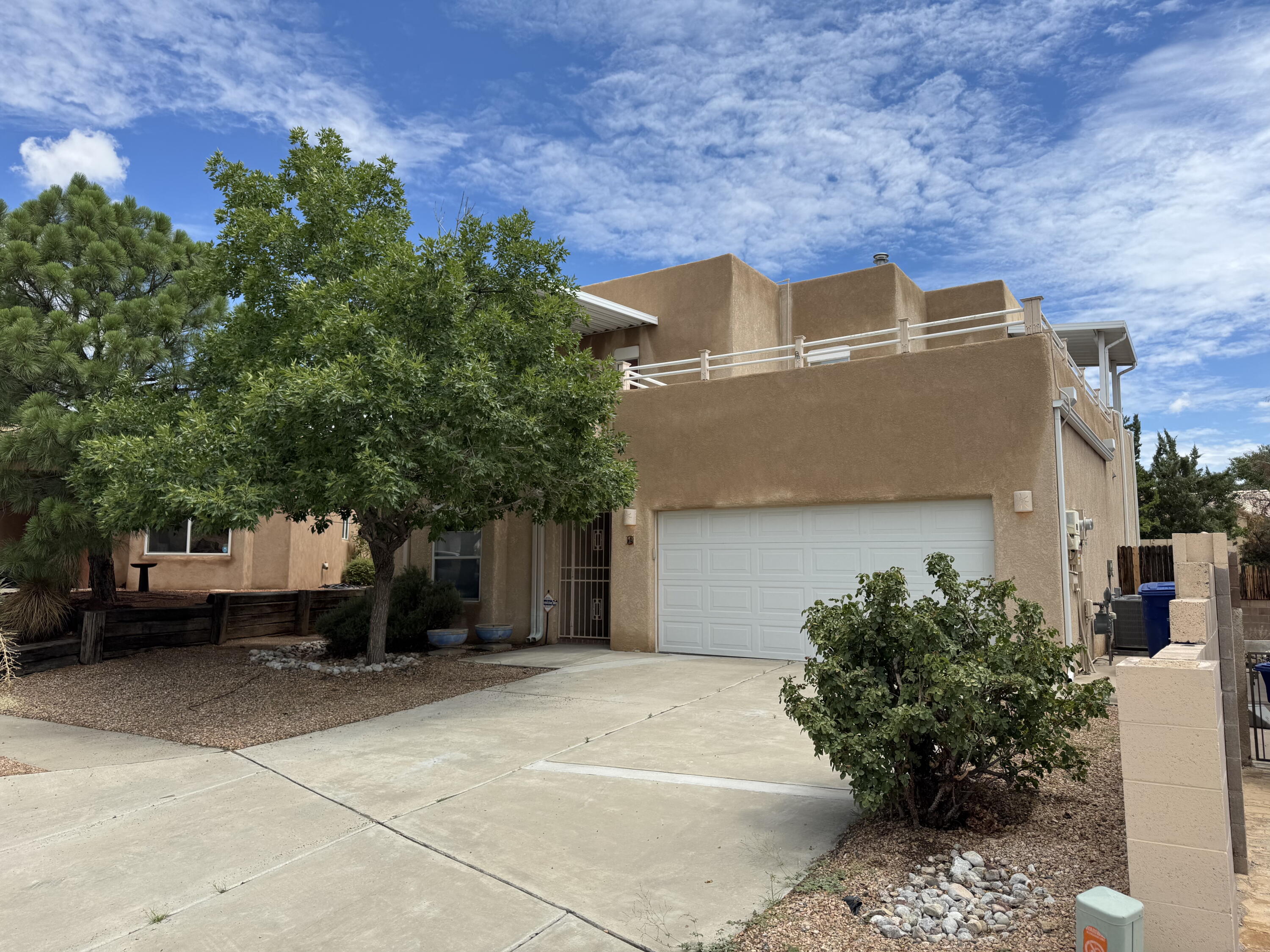 Located in a prime westside location, this home features easy commutes, fantastic views and great amenities! This 4 bedroom home has 4 large bedrooms, 2 beds on main lower level with a jack & jill bathroom as well as 2 upper bedrooms; 1st is a junior primary bedroom with its own 3/4 bathroom and personal patio access with breathtaking views of the Sandias, bosque and city! The 2nd upper bedroom is the main primary and has its own full master bathroom, spacious size and also a private patio access which wraps around the upper level and joins the other upper patio space. This home has a gorgeous kitchen with granite counters and sink basin, large storage cabinets, black appliances, pantry spaces, saltillo tile on lower level, window treatments, new AC and furnace, solar panels, fruit trees,