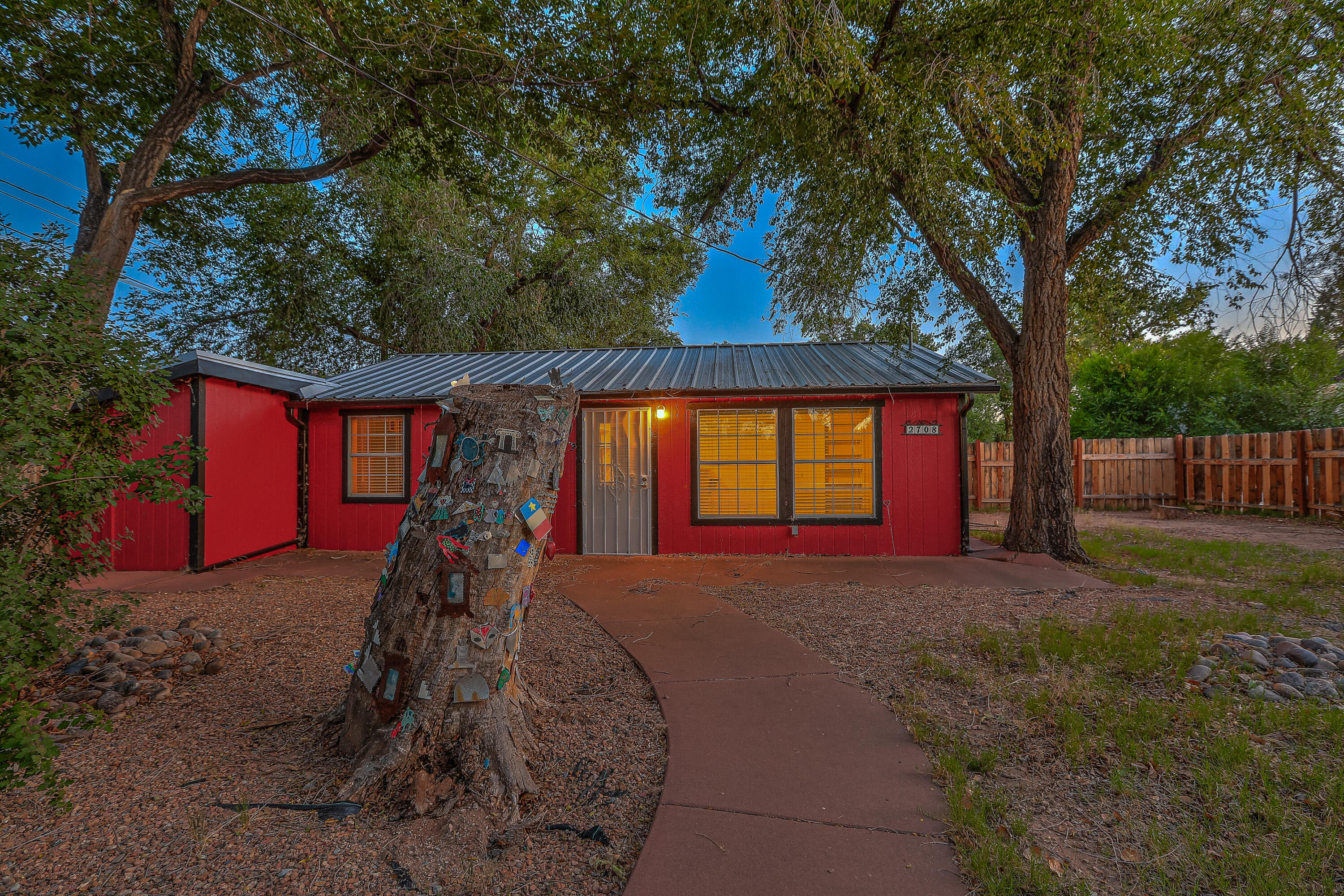 Welcome to a slice of heaven!  This beautiful, private 0.35 Acre lot is located in the heart of the North Valley. An amazing opportunity to purchase in an ideal location and to own a special, happy place!  This peaceful, serene property is filled with dappled sunshine streaming through Cottonwoods, Willows & Ponderosa pines. Steps to the Rio Grande Nature Center, walking trails, & local eateries, the location is accessible yet extremely private. The main home is a charming 1-bedroom casita with a fenced yard.  A workshop with electricity and a storage shed provide additional storage and flexibility.