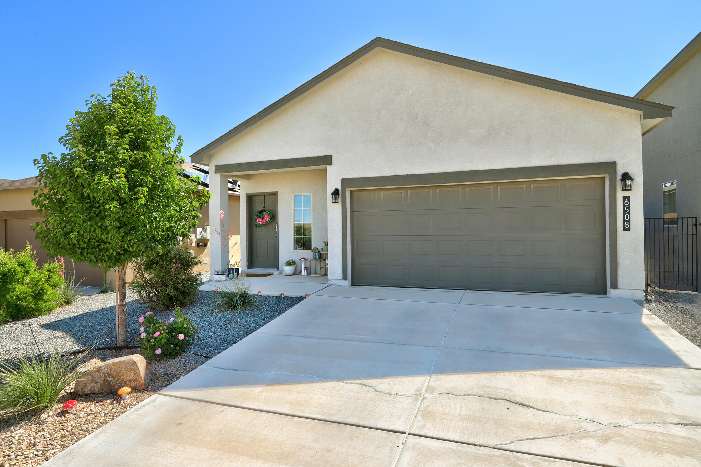 Sleek and Stylish single level home with lots of natural light! Check out this clean and well kept  Dr Horton home that provides easy living with a modern touch.  Open floor plan with soft neutral tones and granite countertops in the kitchen. Spacious primary bedroom with a tiled shower, dual vanities and a generously sized walk in closet.   Fully landscaped backyard is perfect for entertaining or relaxing and with no home directly in front, you'll love the extra sense of space.    Located just off HWY 550 makes for a easy commute to Albuquerque, Rio Rancho and even Santa Fe. A smart choice for convenience, comfort and value!