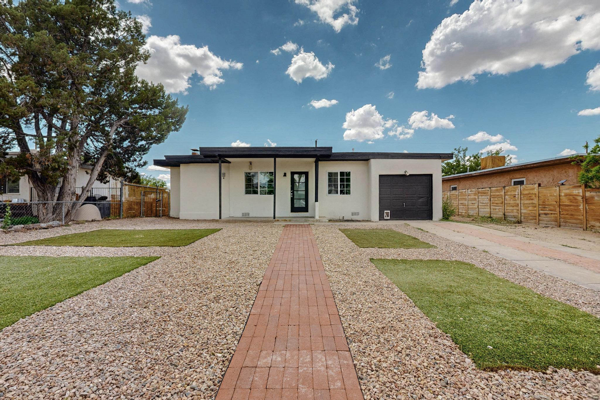 Beautifully renovated 3-bedroom, 2-bath home in the heart of Albuquerque. This property underwent a major remodel (2025): new TPO roof, all new windows, new insulation throughout, new refrigerated air mini-split units in every room (4 total), new drywall, stucco, and paint, high-end wood flooring, completely remodeled kitchen and bathrooms, the list goes on. All new appliances, including washer and dryer, are included. The attached finished one-car garage provides convenience and additional storage. An ample backyard with easy alley access and a large shed is a clean canvas for your imagination. Don't miss the opportunity to own this turnkey, completely remodeled home in a vibrant community located near Uptown, shopping, dining, and more. Schedule your showing today and envision the possi