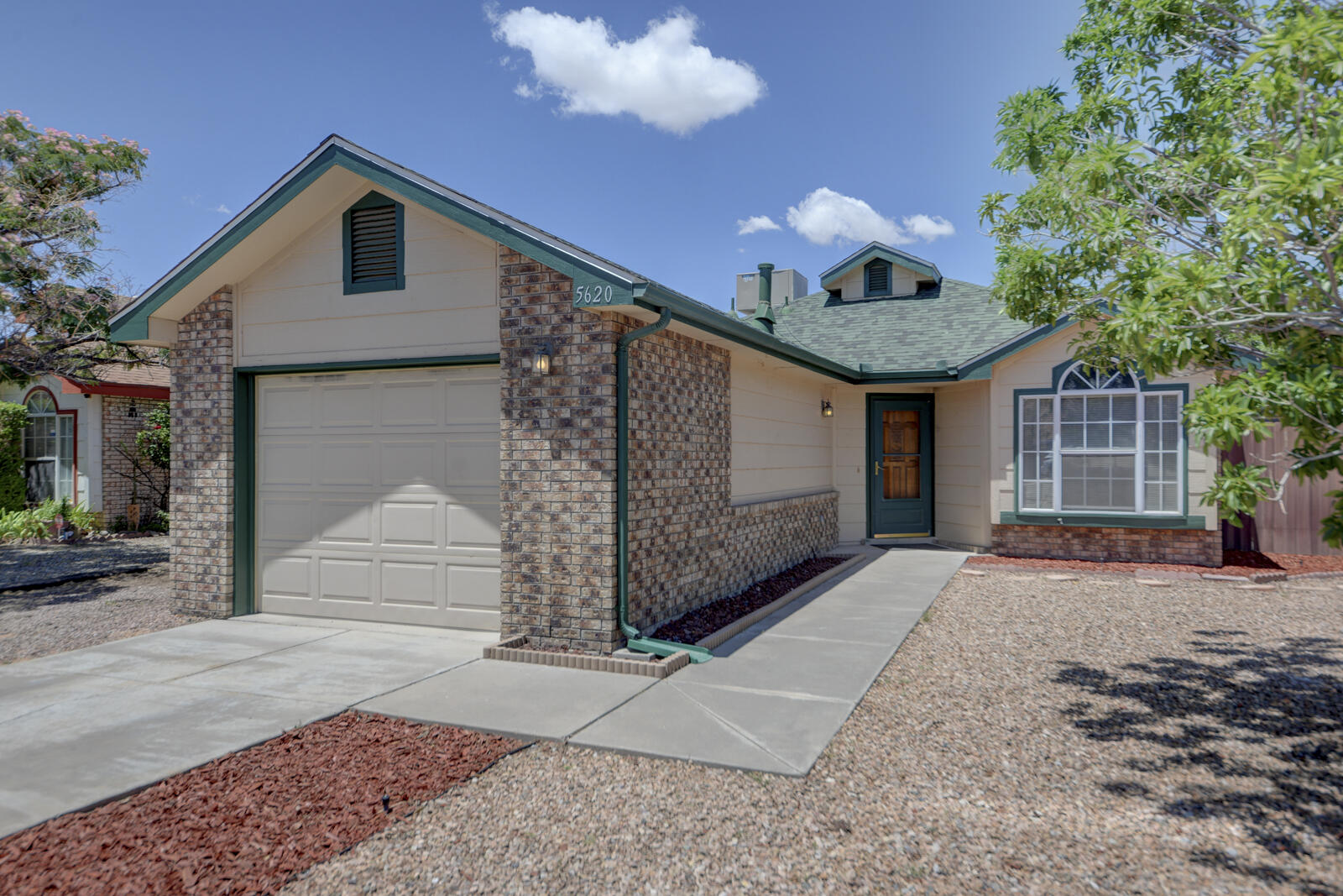 Sivage Thomas brick beauty!  Perfect for 1st time homebuyer or just sizing down.  2 bedroom, 2 full baths, 1 car garage located on a cul de sac lot measuring an ample .23 of an acre.  Newer roof, water heater and evaporative cooler all replaced in 2023. Landscaping is easy, low maintenance SW rock with xeric plantings.  , Cathedral ceilings, cozy wood  burning fireplace, and laminate wood look flooring add to the welcoming warmth of this special home.  This superb location is close to walking and biking trail leading to wonderful Mariposa Park. Also, close to elementary and middle school.  High school is Volcano Vista High School.  Easy shopping at a number of convenient stores near by.  Easy access to Bosque Trails.