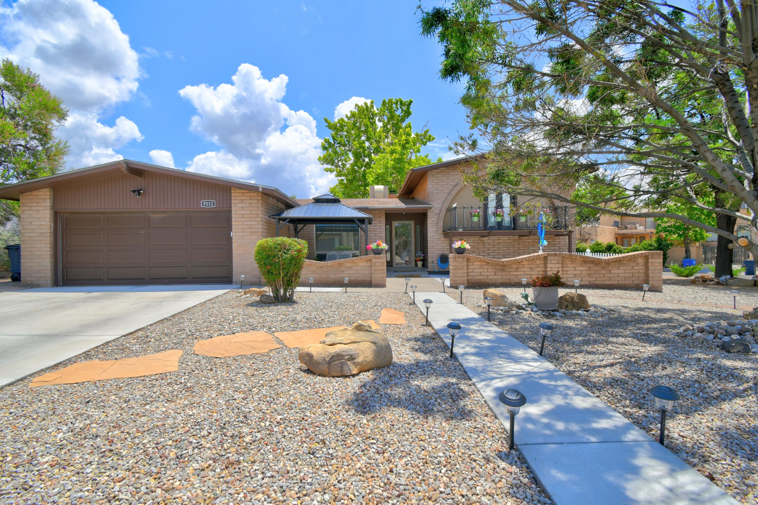 Amazingly updated! Home is a terrific  tri-level on a large corner in great area. convenient to all the amenities of life. New entry courtyard invites you sit and enjoy the wonderful ABQ mornings. The backyard boast of a covered patio offering shade for large parties or quite relaxing moments for you and yours. Formal living room is always ready for visitors. Family room adjacent to kitchen is very welcoming entertaining area. Kitchen is open and a pleasure to prepare those holiday dinners. Separate Master on upper level gives you a private area just steps away. Upstairs office lets you make a mess (not you!) and no one sees it. Guest bedrooms on lower level lets your company enjoy their own space. The garage is oversized to store it all! The whole house is a joy to live in.