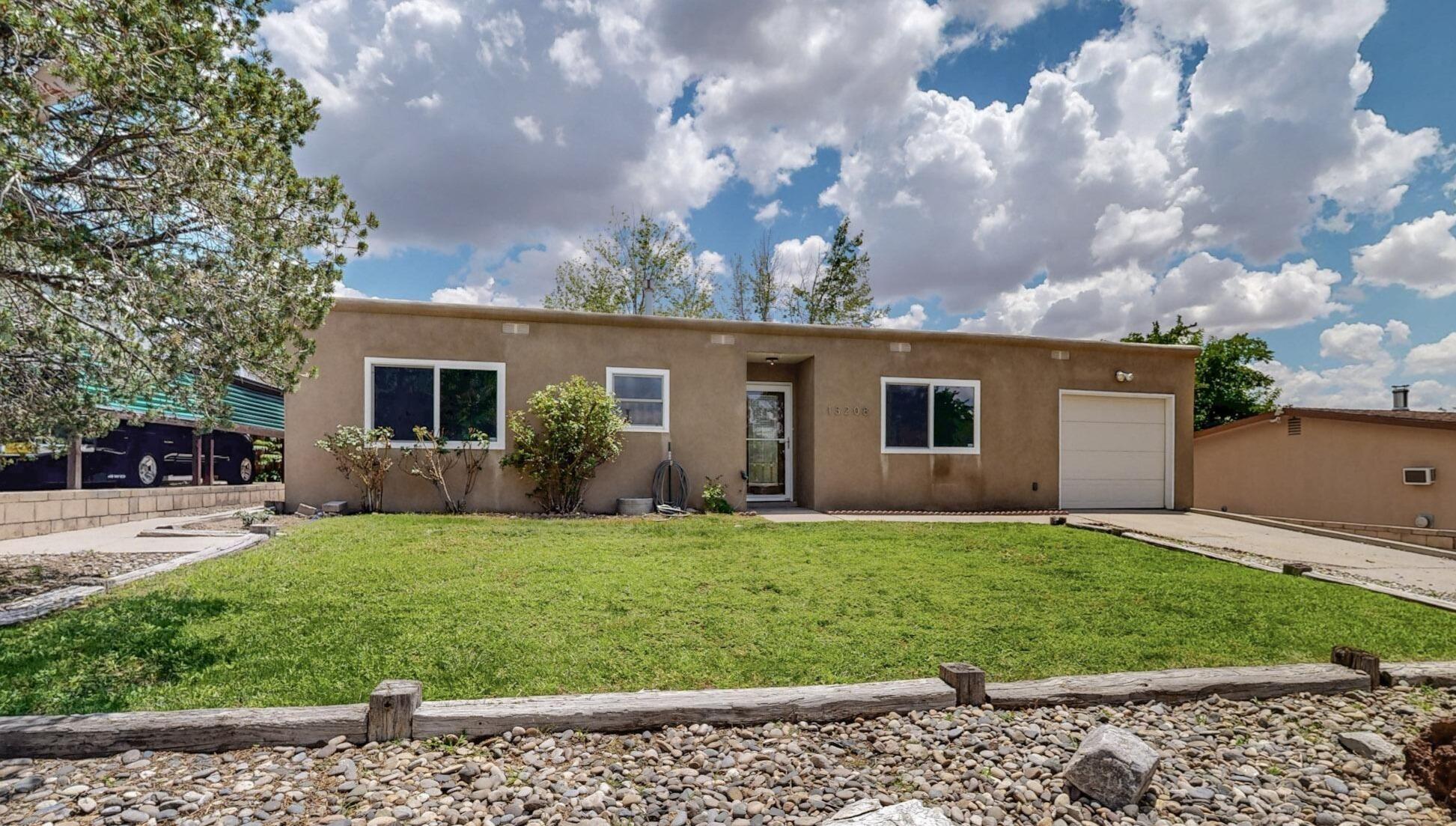 Beautifully updated air-conditioned home in the NE Heights! This 3 Bed, 2 Bath 1,291 sq. ft gem features an open floor plan with new waterproof laminate flooring, paint & carpeting throughout.The just remodeled Kitchen boasts new maple cabinetry with 36''tall uppers, crown molding, granite counter top sand stainless-steel gas range, dishwasher, microwave. Furnace and water heater were installed in 2022.The front yard has working sprinklers and was just re-seeded.The spacious backyard has an ample covered patio that is great for entertaining, two storage sheds and several garden spots ready for your green thumb!Conveniently located near parks, schools, and shopping!Owner is a licensed NM real estate broker.