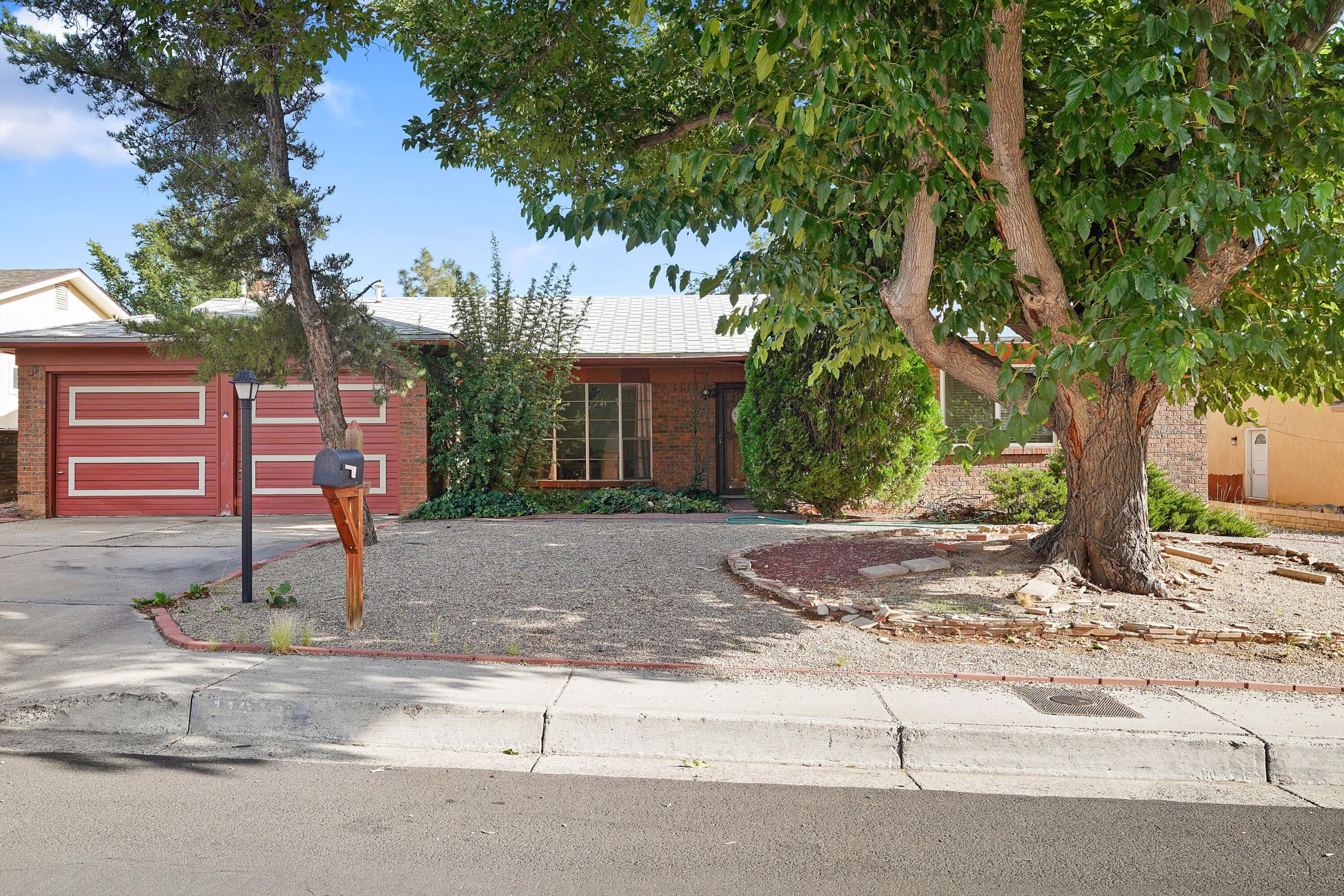 Nestled in one of Albuquerque's most sought-after neighborhoods, this property offers the perfect canvas to create your dream home. Whether you're drawn to the mature trees, mountain views, or the unbeatable location, this home is full of potential.Enjoy the ease of daily living with quick access to shopping centers, local eateries, and essential services--all just minutes away. From weekend errands to dinner plans, everything you need is right around the corner. With nearby parks and outdoor trails, the lifestyle here is as vibrant as the surroundings.