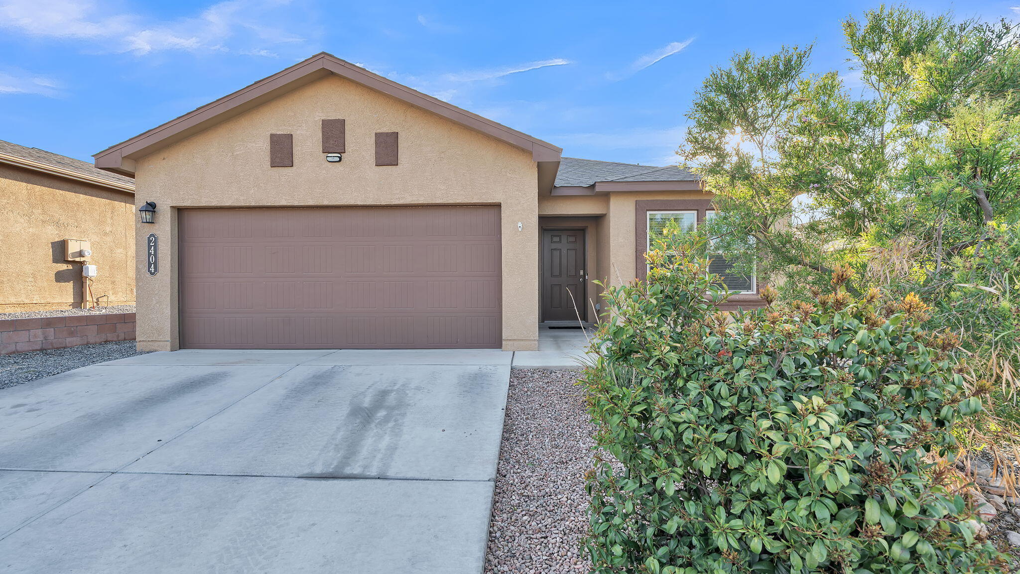 Practically New! DR Horton home in a gated community near I-40 and shopping! This home offers 9-foot ceilings,  tile throughout the living areas, kitchen, dining, baths, and laundry room. Granite countertops in the kitchen, Whirlpool appliances, and a spacious layout perfect for entertaining.  Enjoy smart home features like a video doorbell and Bluetooth connectivity. The low-maintenance backyard includes turf, a covered patio, and plenty of space to relax.