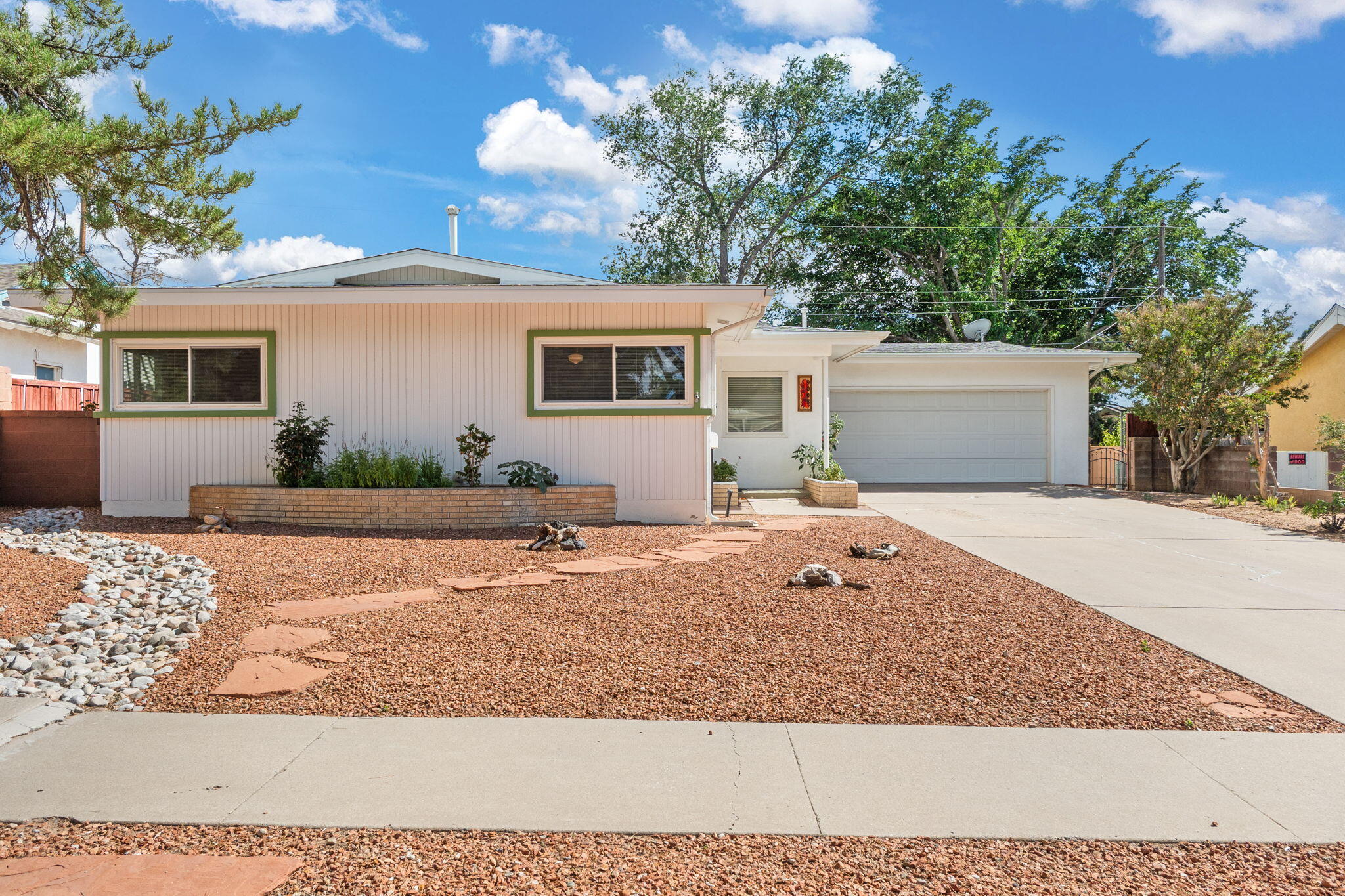 Cozy Mid-Century Modern with Unique Vintage Charm!Lovingly maintained and full of character, this 2-living-area home features rare mid-century touches like an in-wall toothbrush holder, razor disposal in medicine cabinet, mail drop, and built-in foil dispenser. Enjoy a beautifully landscaped front yard and a lush backyard retreat perfect for relaxing or entertaining. Updates include a new water heater (July 2025), roof (2016), and double-pane windows (2004 all except for bathrooms). Pride of ownership shines throughout. A truly special home you don't want to miss!