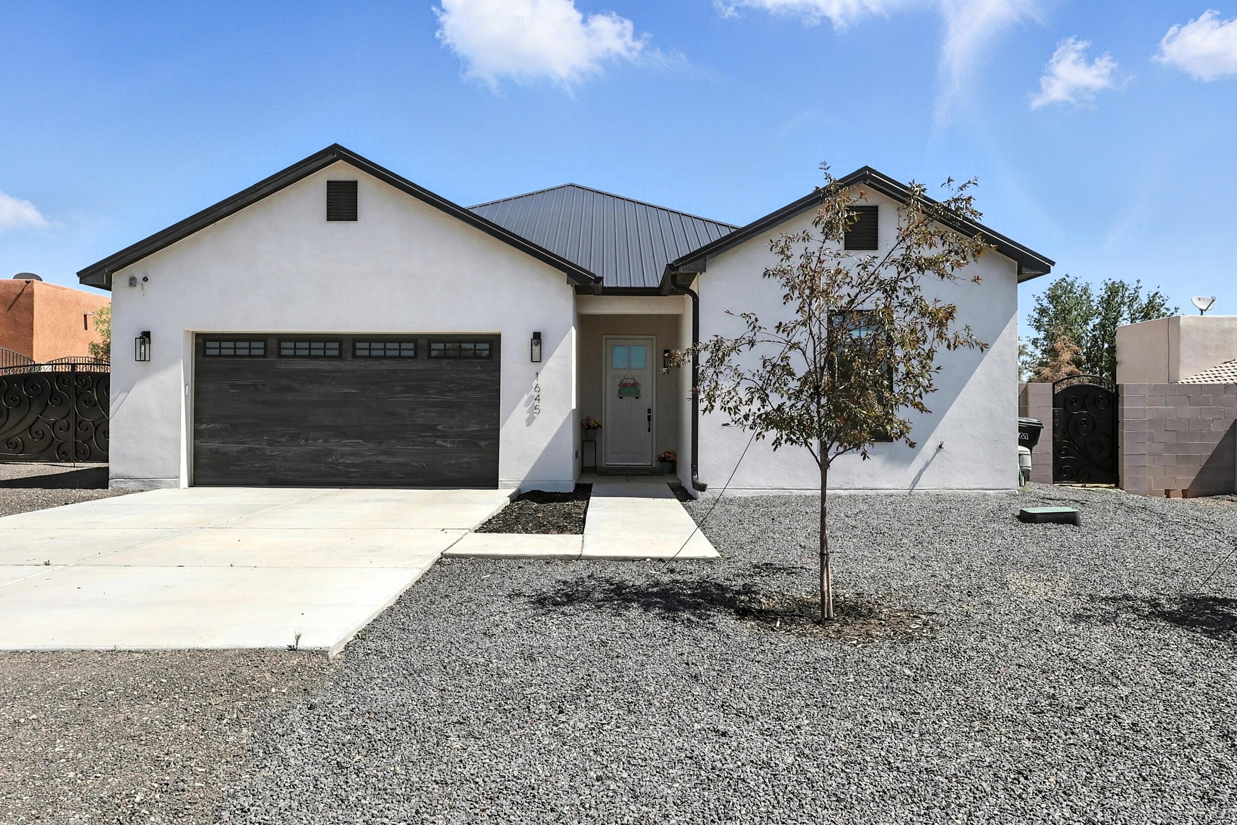 Welcome to this stunning 4-bedroom, 3-bathroom home in the heart of Rio Rancho, built by premier luxury builder Connected Construction. Situated on a spacious half-acre lot, this home offers both refined interior living and endless outdoor potential. Inside, you'll find thoughtfully designed spaces with high-end finishes, an open-concept layout, and abundant natural light. The expansive backyard is a blank canvas,ready for your dream landscape, pool, or outdoor retreat. Experience comfort, quality, and opportunity in one exceptional property.