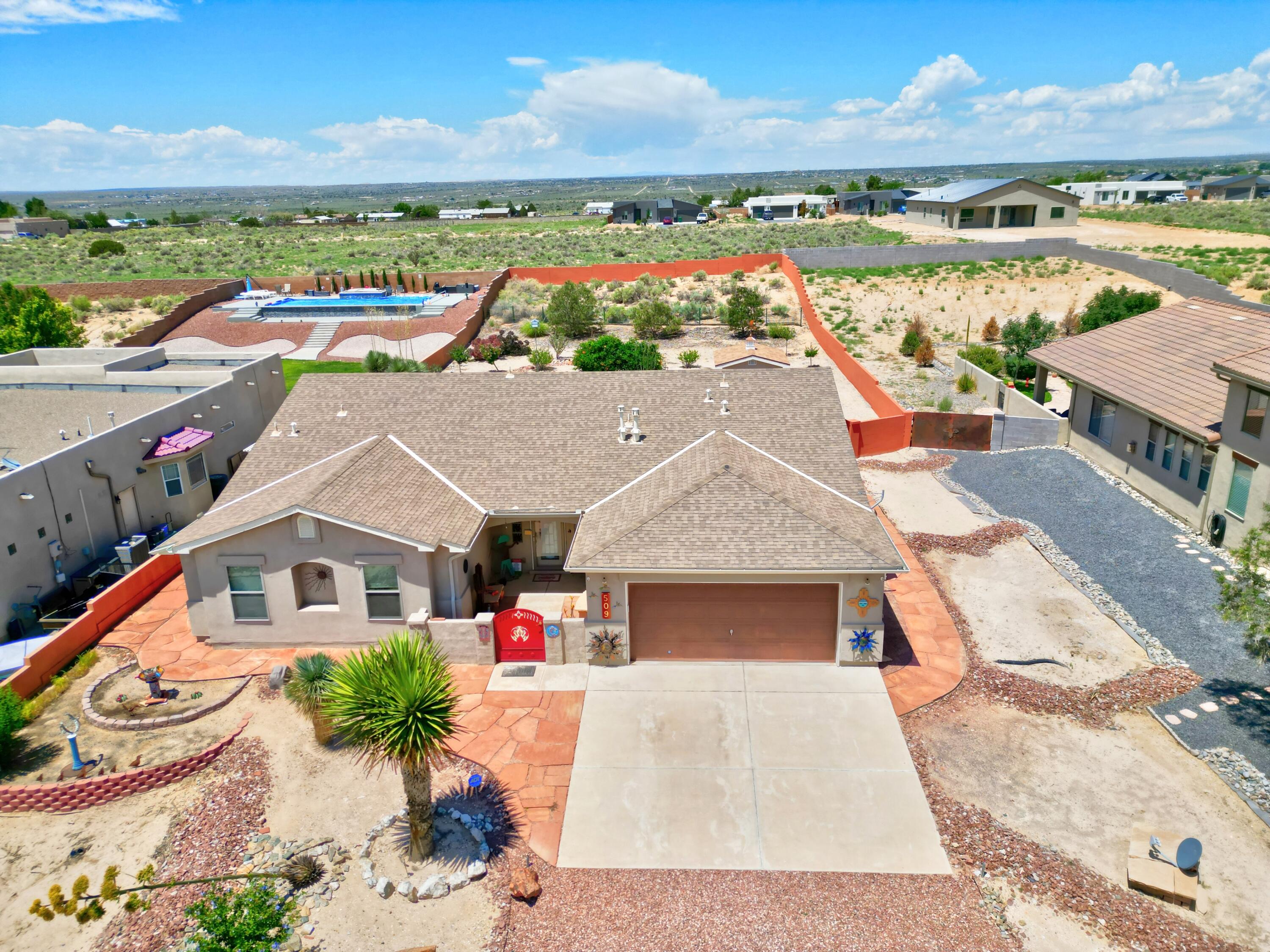 Stunning single-story home in northern Rio Rancho with 3 bedrooms, 2 baths, and over 2,000&#8239;sq&#8239;ft of living space on a generous&#8239;1/2&#8209;acre lot. The thoughtfully designed floorplan places the primary suite separately from two guest rooms--perfect for privacy and multifunctional use. The spacious primary bath features both a separate soaking tub and stand-up shower. The home is oriented to showcase breathtaking Sandia Mountain views from the front, with a welcoming curb appeal. Located minutes from top-rated schools, shopping, and parks, this property combines serene natural beauty with daily convenience.