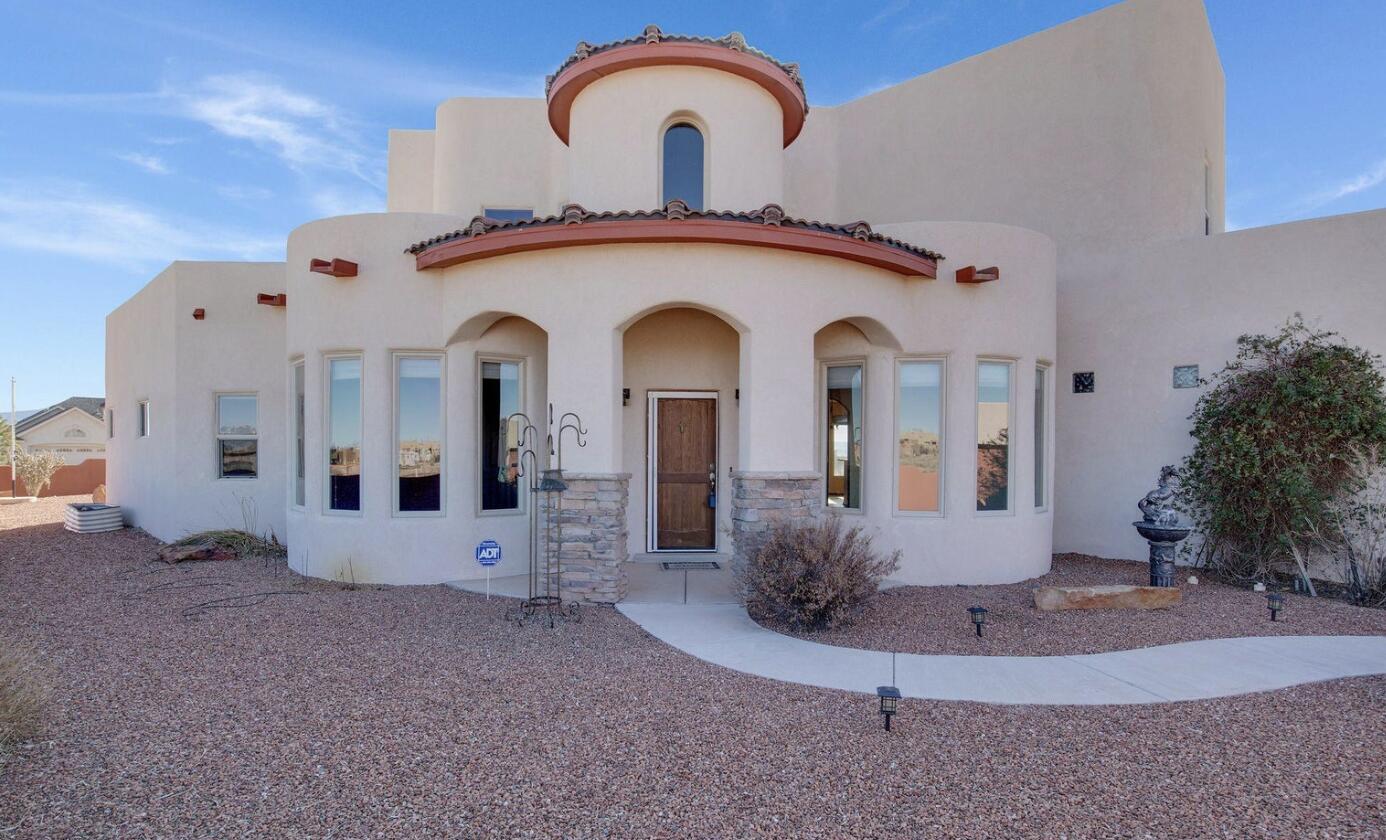 Breathtaking Views, Exceptional Upgrades, and Endless Space in Rio Rancho EstatesWelcome to this stunning custom home perched on a spacious half-acre lot in highly sought-after Rio Rancho Estates--where breathtaking views of the Sandia Mountains and the Albuquerque cityscape unfold in every direction. Whether you're enjoying the sunrise from your private trex-deck balcony or winding down under the stars, this home offers unmatched beauty and tranquility.Inside, the residence is filled with thoughtful updates and character. A grand round turret-style foyer welcomes you into a bright and open floor plan featuring a large living room with a cozy Kiva-style fireplace, a formal dining room, and a generous recreation room complete with built-in bookcases and a wet bar -- perfect for