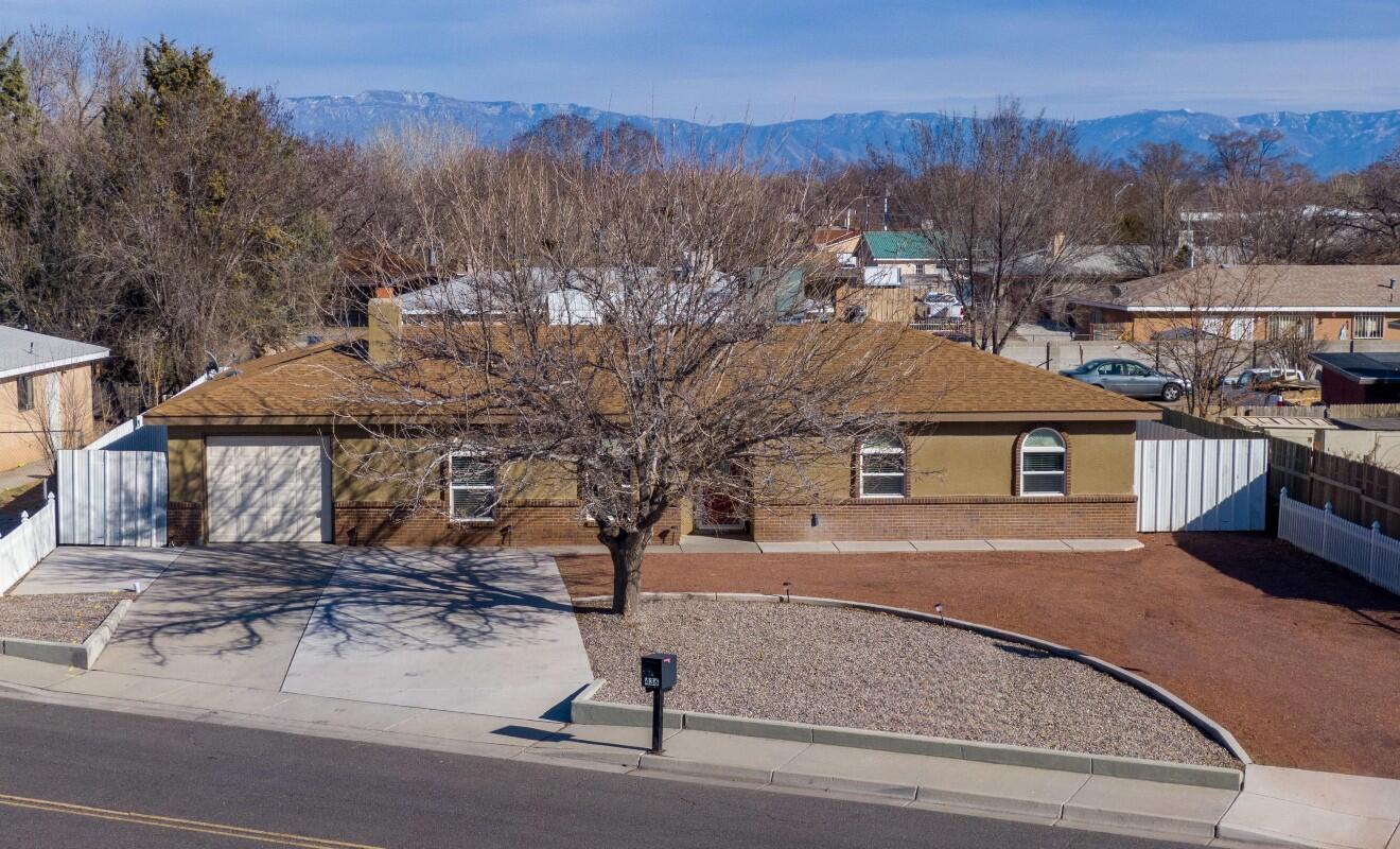 Located in the heart of Los Lunas this home offers 4 Bedrooms, with one of rooms located off of the garage for in laws or office space. The open floor plan offers natural lighting as well as a cozy fireplace. This home has ample parking for cars as well as RV space. To complete this home there is a man cave/workshop in the backyard perfect for entertaining or hobbies as well. Large open patio and sidewalks around the house. Backyard is fenced with metal fencing. Call Today to take a tour of this lovely home!