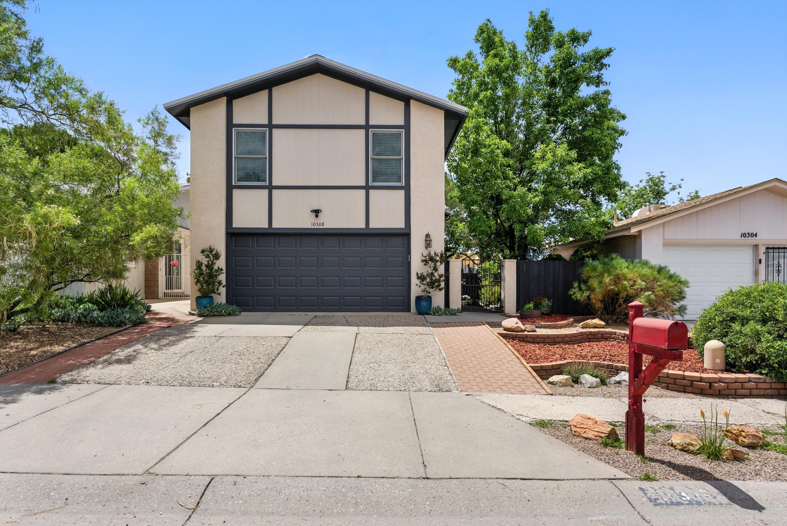 Welcome to this charming home in the Oso Grande neighborhood.  This home features a spacious great room with soaring ceilings, a fireplace and lots of natural light.  The kitchen has been renovated in the past with maple cabinets, solid surface counters along with stainless steel appliances.  Upstairs you'll find a loft, and 2 more rooms including an oversized primary suite with vaulted ceilings & a wet bar.  Enjoy the outdoors with mature trees and landscaping, patio area, and storage shed. Short walk to beautiful Oso Grande park & CNM campus.  Very well kept, come see this move in ready home today.