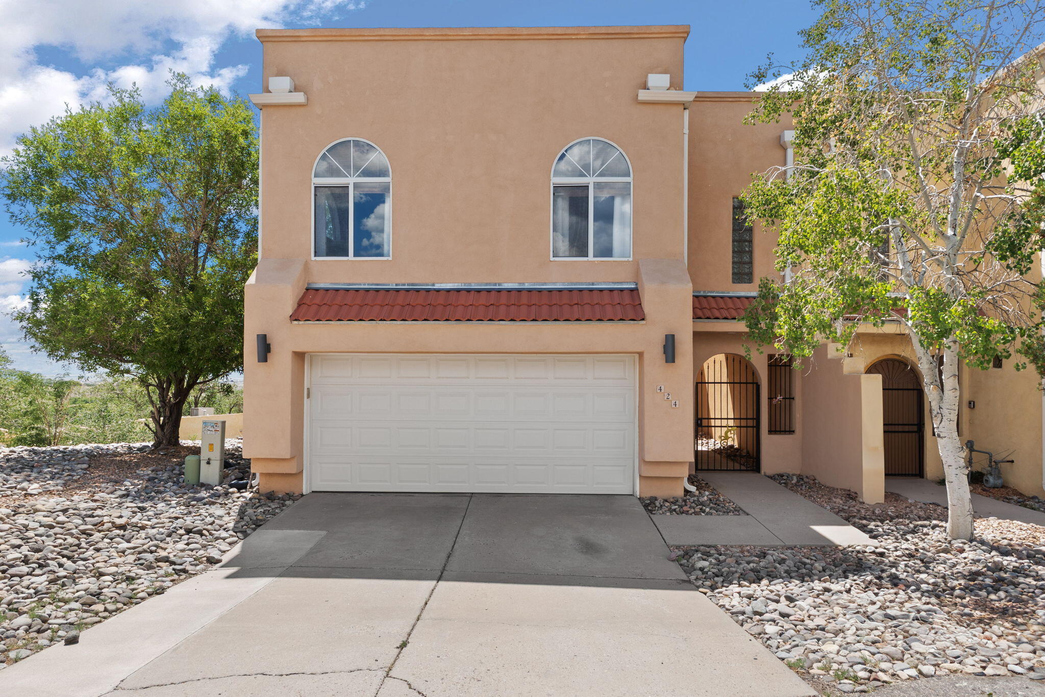This captivating home in the foothills offers panoramic views of both the twinkling city lights and majestic mountains from nearly every window upstairs!  Be ready to fall in love! The  great room is designed for entertaining or hanging out complete with a sleek glass-enclosed gas fireplace,  and access to a balcony where the sky feels close enough to touch.The chic kitchen is a showstopper, totally renovated with stainless steel appliances, granite countertops, and a layout that flows beautifully into the living & designated dinning spaces. The spacious and private primary suite includes a generous walk-in closet and an en-suite bath with double sinks, a walk-in shower, & a separate jetted tub giving all the feels of a personal spa.  Downstairs there are 2 bedrooms connected by a stylish