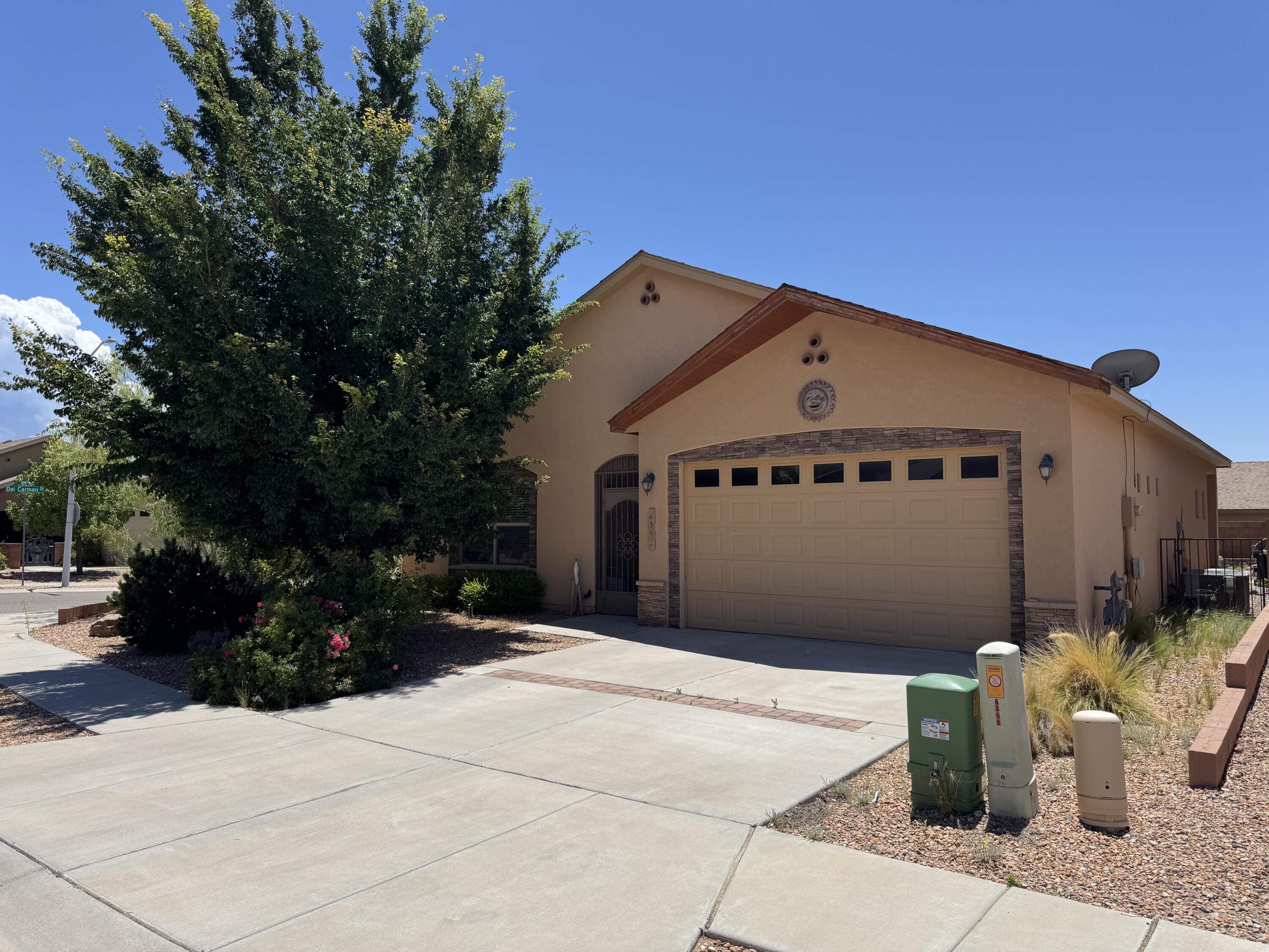 Built Green NM GOLD = serious energy savings! This home sits on a premium corner lot near the end of a quiet dead-end street in a highly desirable location. Enjoy lush landscaping, a gated tongue-and-groove entry, and a bright, open layout with trey ceilings and Low-E windows. The kitchen features Corian counters and HE appliances--plus washer & dryer stay! Primary suite includes soaking tub, double vanity, and walk-in closet. Tankless water heater, 95% efficient furnace, 15 SEER A/C, 2x8 construction, and solar-ready. Don't wait--this one won't last!