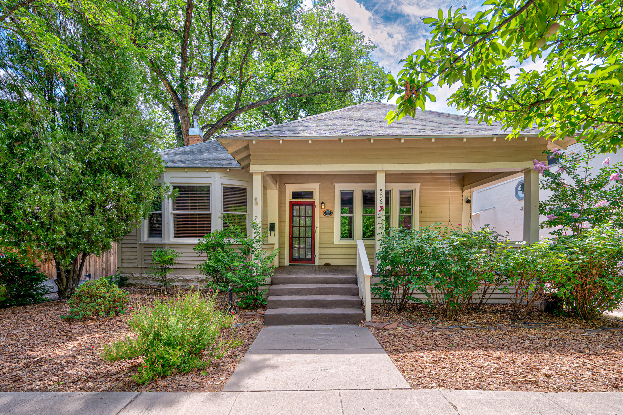 506 11th St NW is a beautifully maintained and updated historic home built in 1910 and located in the Historic Fourth Ward Neighborhood District of Albuquerque. The main home is registered with the National Historic Registry. It features 1700 sq ft with a 950 ft detached guest house (casita). Both homes are privately spaced with individual courtyards, and privacy fence, and separate parking and entryway. Main home features large bedrooms (2), one bath, and one half bath. Spacious living areas and kitchen with traditional molding and a historical feeling throughout. Step on beautiful wood flooring in the main home. The Casita has  Santa Fe ''style'' feeling.  Casita features one bedroom, one bath with  living room area.Home was used Netflix movie ''Ransom Canyon''