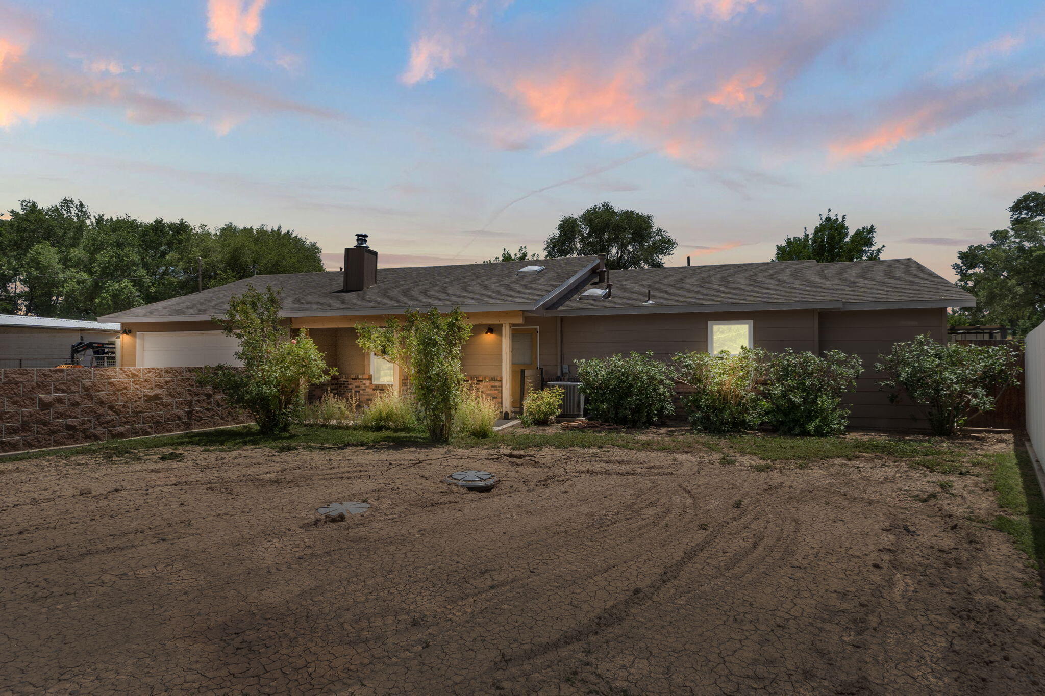Spectacular 1.15 acre lot in Los Lunas is away from the hustle and bustle of the city and ready for its next owner!  In the home, you'll find a perfectly sized kitchen overlooking the living room and fireplace.  Excellent space for entertaining family and friends.   Most recent notable updates include; windows and electric gate in 2019, backyard patio in 2020 and HVAC with refrigerated air and roof in 2023.  Additionally, there is tile and laminate flooring throughout the home, no carpet!  You'll enjoy the space with the nicely maintained backyard and front yard pasture.  If that was not enough, the barn and corral provide additional storage and workshop.  Let's not forget the 30 amp and sewer line RV hookups!  Seller is offering $5,000 concession for closing costs or interest buydown.