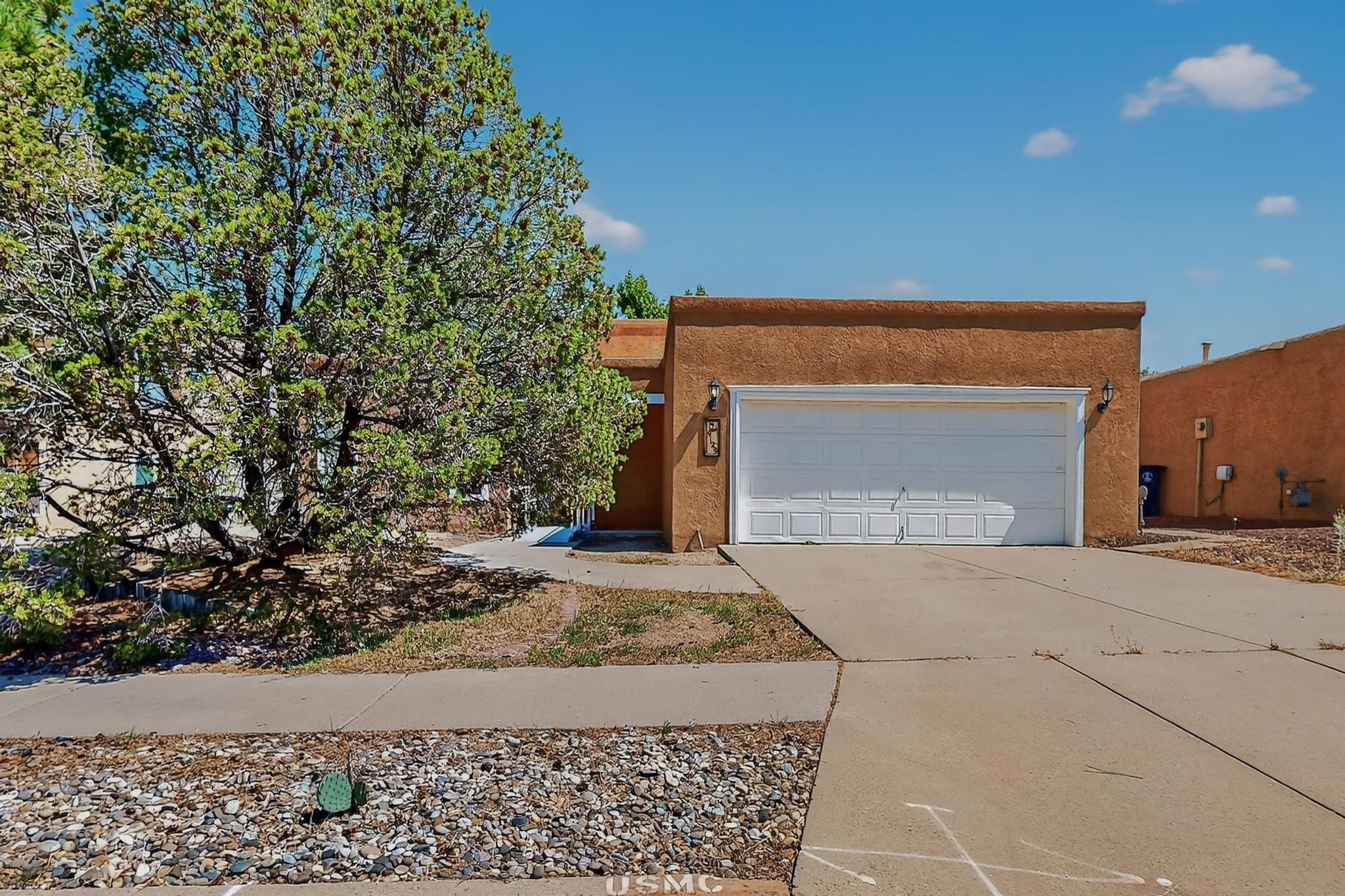 Charming 3BR, 3BA, 2CG home in the desirable Heritage East subdivision! La Cueva School District! Features gorgeous Saltillo tile, 3 cozy fireplaces, classic vigas, plantation shutters, and skylights that flood the home with natural light. The kitchen comes fully equipped--all appliances convey. Enjoy mirrored closets, ceiling fans, tile-surround shower, and double sinks. Unique Venetian-painted wall pairs beautifully with the tongue & groove ceiling. Relax by the window seat and take in the peaceful ambiance. This home blends Southwestern charm with everyday comfort--don't miss out, this gem will sell fast!