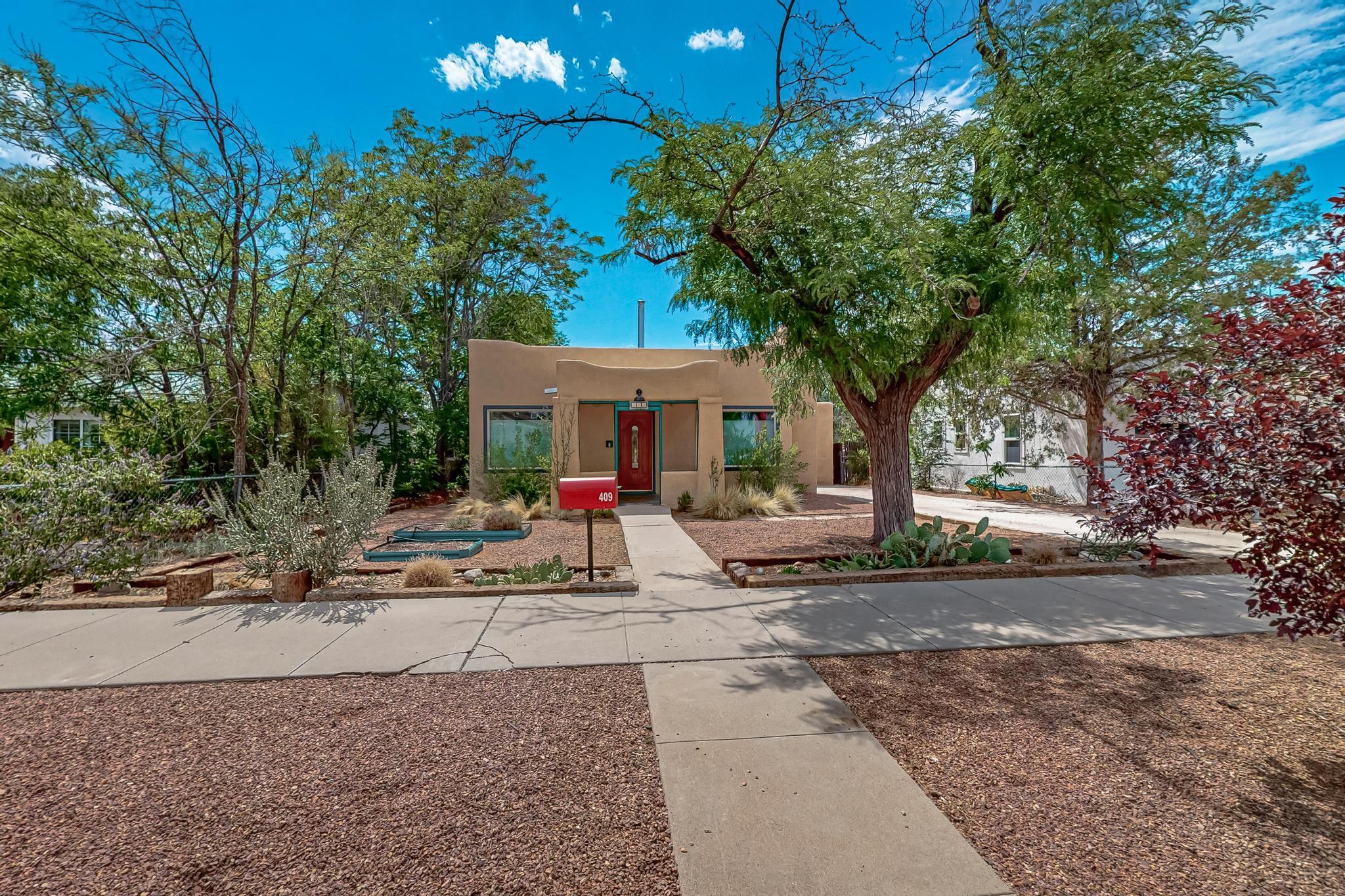 Welcome to your new happy place near UNM! This adorable 3-bedroom, 3-bath home is beaming with charm. Imagine cozy evenings by the fireplace and enjoying cool air with refrigerated air on warm summer days. The living room is equipped with new double pane windows for efficiency and peace and quiet. The lovely hardwood floors give it a warm feel, while the covered back patio is perfect for weekend barbecues or sipping coffee in the morning sun. You'll appreciate the convenience of a basement/laundry room, and with newer stucco and a TPO roof installed in 2021, maintenance is a breeze. Being just blocks away from Nob Hill, you'll have great shopping and dining at your fingertips. This is not just a home--it's a fantastic investment opportunity for UNM housing!