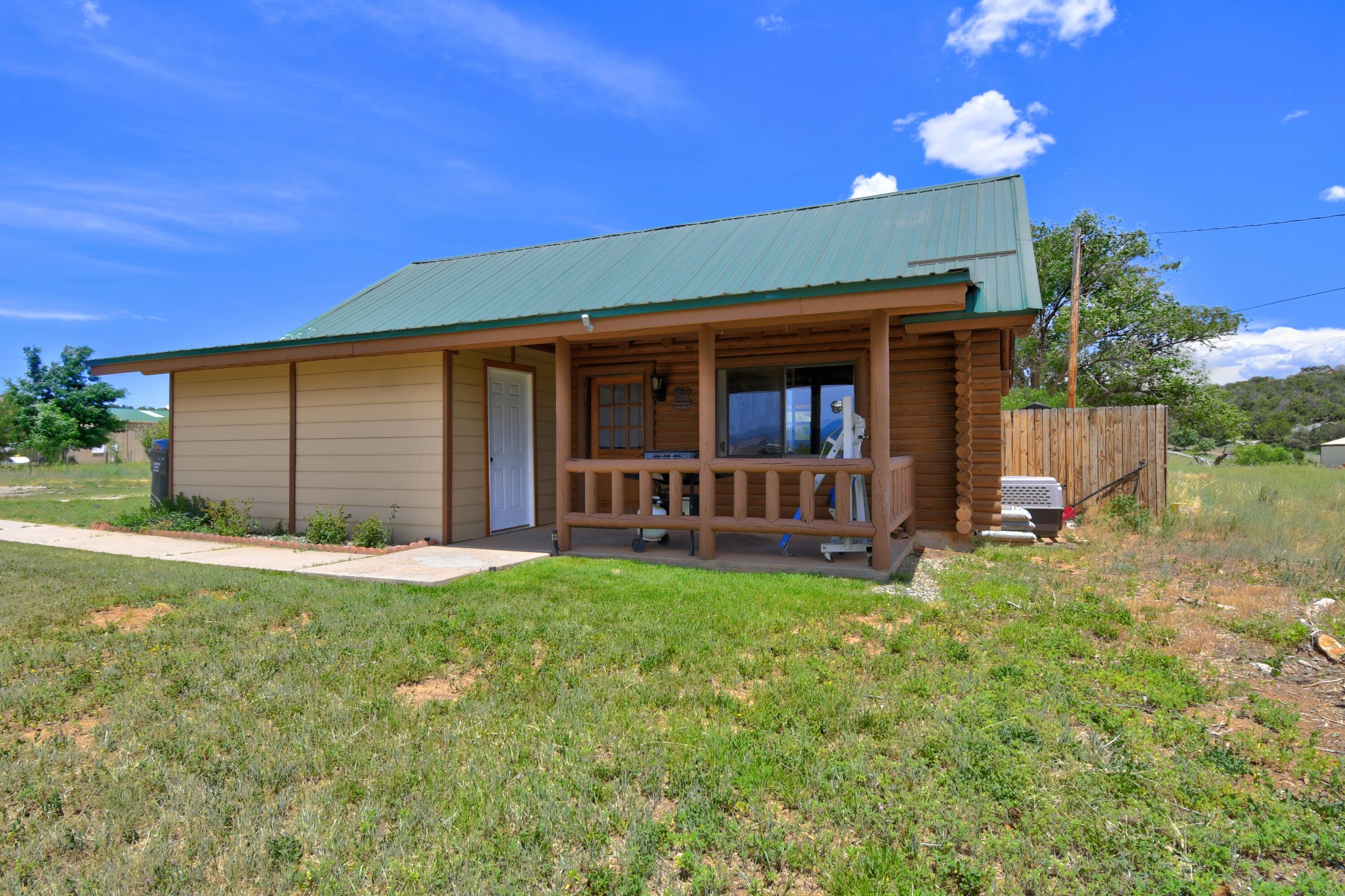 Welcome to this beautiful 3-bedroom log cabin that perfectly blends rustic charm with modern comfort. Cozy up by the efficient pellet stove on chilly evenings and enjoy the warmth and character this home offers. Downstairs features updated flooring, while the loft boasts stunning real hardwood floors that add timeless appeal. The kitchen has been tastefully updated with white cabinets and a sleek sink, and the bathroom shines with an updated vanity, tub, and surround.Every detail has been thoughtfully upgraded to make this cabin feel like home. Whether you're looking for a full-time residence, weekend getaway, or a second home, this gem is sure to impress. Don't miss your chance to own this retreat.