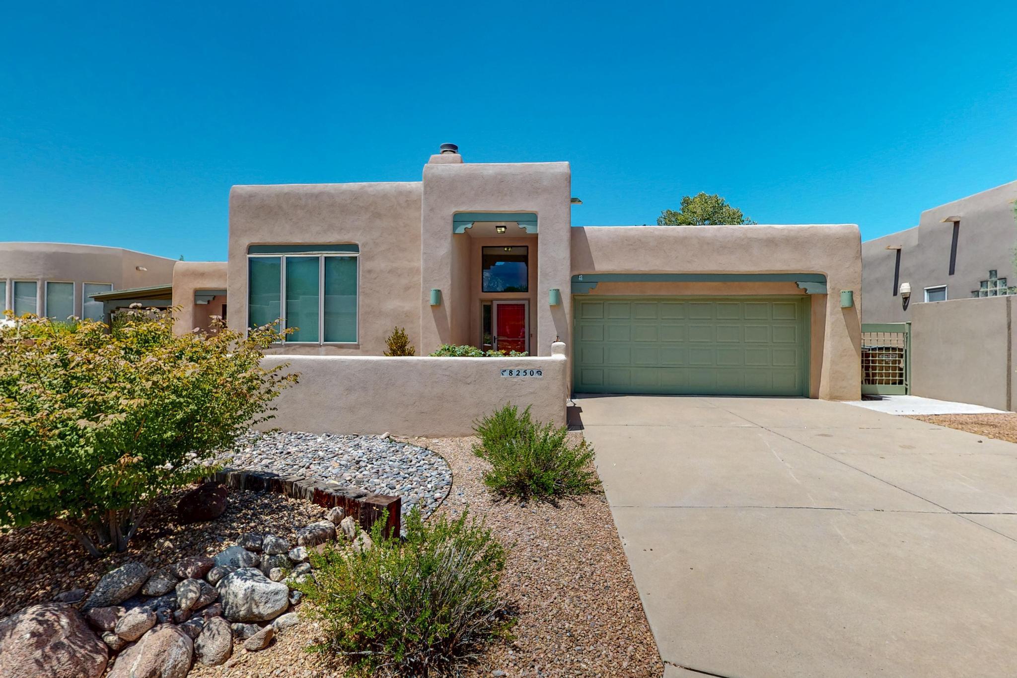 Scenic Sandia Foothills Retreat with Breathtaking Views.  This charming home offers stunning views and timeless Southwest character. A welcoming front courtyard leads you into a spacious great room featuring raised wood ceilings with exposed beams and a cozy kiva fireplace--perfect for relaxing or entertaining. The thoughtfully designed kitchen includes a sunny breakfast nook with access to its own private patio, as well as a formal dining room for gatherings. The primary suite is a private retreat with outdoor access, an oversized walk-in closet, and an en-suite bath. Two additional bedrooms are situated on the opposite side of the home for added privacy.Enjoy seamless indoor-outdoor living with a large covered patio that opens to t