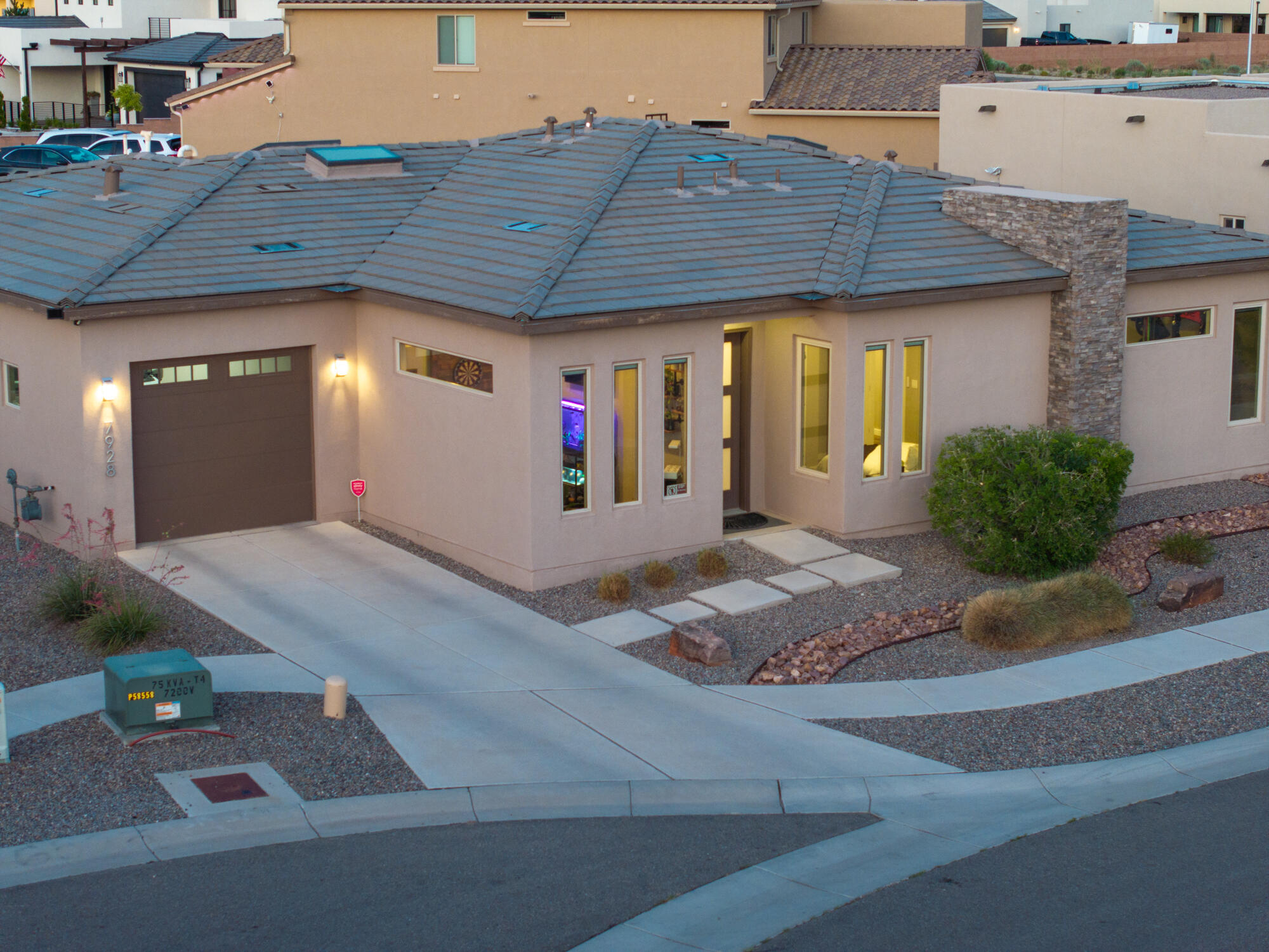 Located in the heart of Petroglyph Estates, this 3-bedroom, 2-bath home, with bonus office/bar is packed with high-end features. Enjoy wood-look tile, quartz countertops, stainless steel appliances, 8-foot doors with 10-foot ceilings throughout the residence, 3 skylights, with views of the Sandia Mountains! Energy-efficient Pella Low-E windows and a NM Green Build Silver rating add comfort and sustainability. Two-car garage, Move-in ready and full of thoughtful touches!