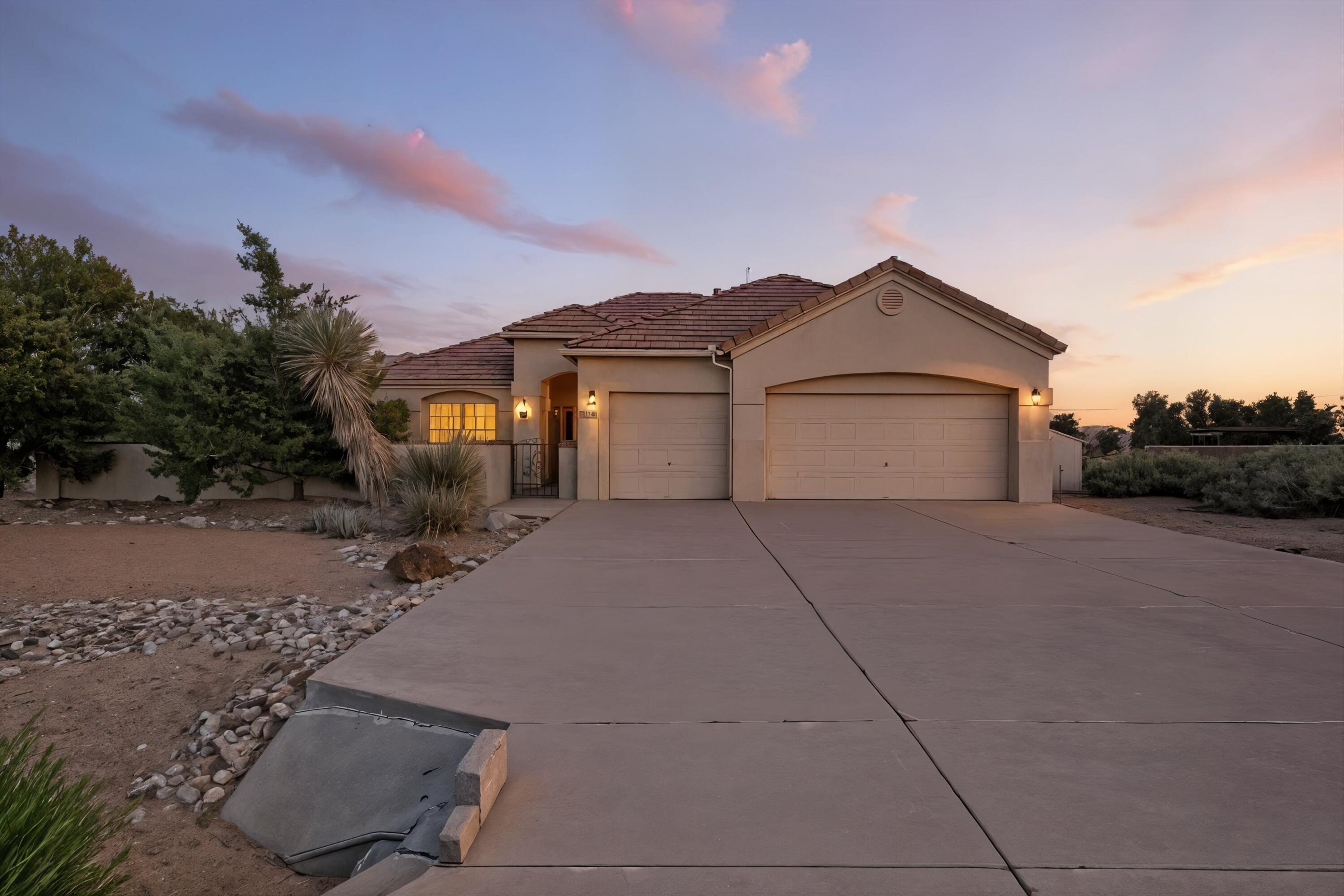 MOUNTAIN SUNRISES AND BOSQUE SUNSETS AWAIT AT THIS BEAUTIFULLY LOCATED HOME IN RIO RANCHO! Tucked between Corrales charm and Rio Rancho convenience, this 4-bedroom, 2-bath gem offers space, style, and scenery. The open floor plan flows from a relaxing living area to a spacious kitchen with bar seating, perfect for gathering. Tile and carpet floors add comfort and durability. Step outside to an extra-large patio with a pergola and take in the landscaped yard and sweeping views. A walk-in closet and thoughtful touches throughout make daily living easy. Don't miss your chance to live in one of Rio Rancho's most scenic spots--schedule your showing today!