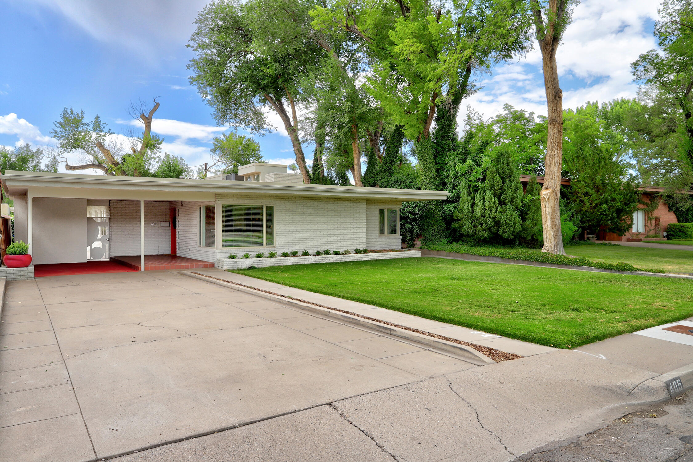 Elegant Mid Century Modern Property with Casita in the Sought After Albuquerque Country Club Area * One of a Kind Home In a Neighborhood Unlike Any Other * Lush and Green with Towering Trees * Re-Envisioned and Re-Designed by a Professional Designer * Spacious Living Room with Built In Bookcases and Storage * Formal Dining Room Shares  Fireplace with Living Room * Kiva Fireplace in Guest Bedroom * Warm Hardwood Floors * Designer Kitchen with Viking Stainless Steel Appliances, Wine Refrigerator, Gas Range and Hood, and Pantry * Light Filled Casita with Built-In Murphy Bed and Shelving, Kitchenette, and 3/4 Bath Is Perfect for Guests or a Home Office * Large Deck In Serene and Private Back Yard * TPO Roof (2022) * New HVAC For House in Feb 2025 * Pella Windows (2017) * Call Your Realtor!