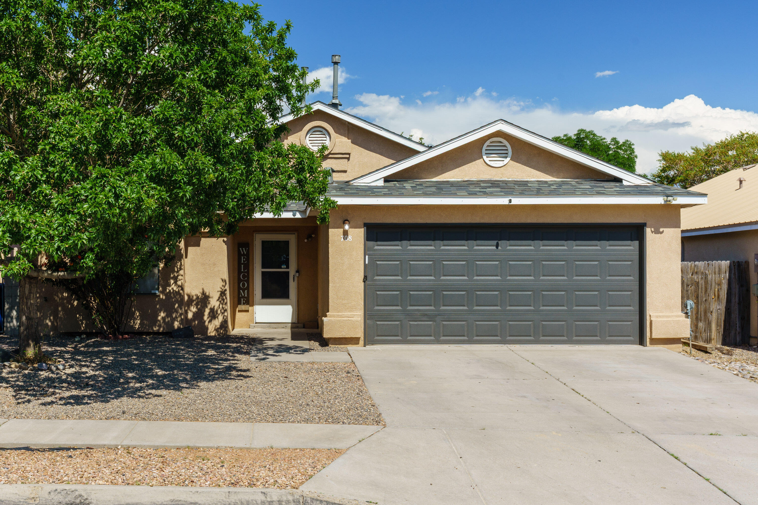 Fresh, clean, and move-in ready--this 4-bedroom, 2-bath home offers over 1,600 sq ft of comfortable living. A new roof and updated refrigerated air provide valuable peace of mind. Inside, you'll find tile flooring throughout the main areas and laminate in the bedrooms, with no carpet. The open kitchen and dining area seamlessly flow into a spacious living room, while the private primary suite features a walk-in closet and en-suite full bath. The fully fenced backyard features a covered patio, mature trees, a water feature, and a storage shed. Located in a quiet neighborhood with convenient access to I-40, parks, and shopping.