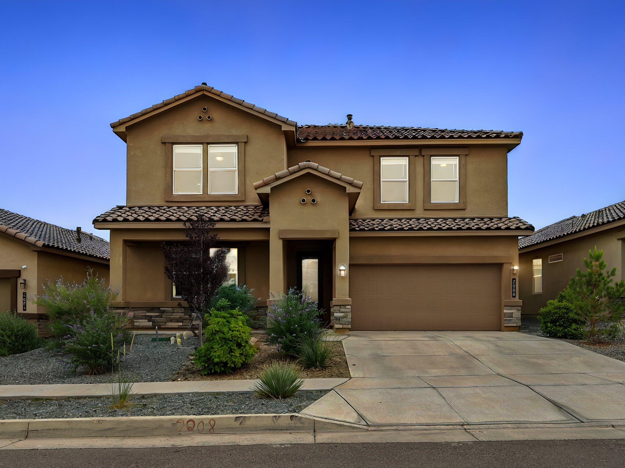 Nestled in the desirable Volterra community, this two-story home offers 5 bedrooms, 3 bathrooms, and refrigerated air. The open-concept layout features a kitchen with granite countertops, stainless steel appliances, a center island, and sleek tile flooring that flows into the cozy living area. Enjoy a spacious loft perfect for an office, hobby, or game room. Smart home features include a central panel that controls thermostats, front door access, lighting, doorbell camera, and more. The garage door is MyQ app compatible for added convenience. The front and backyard are both fully landscaped with low-maintenance turf, decorative rock, and a variety of plants, creating a beautifully finished outdoor space ready to enjoy. Stylish, smart, and move-in ready!