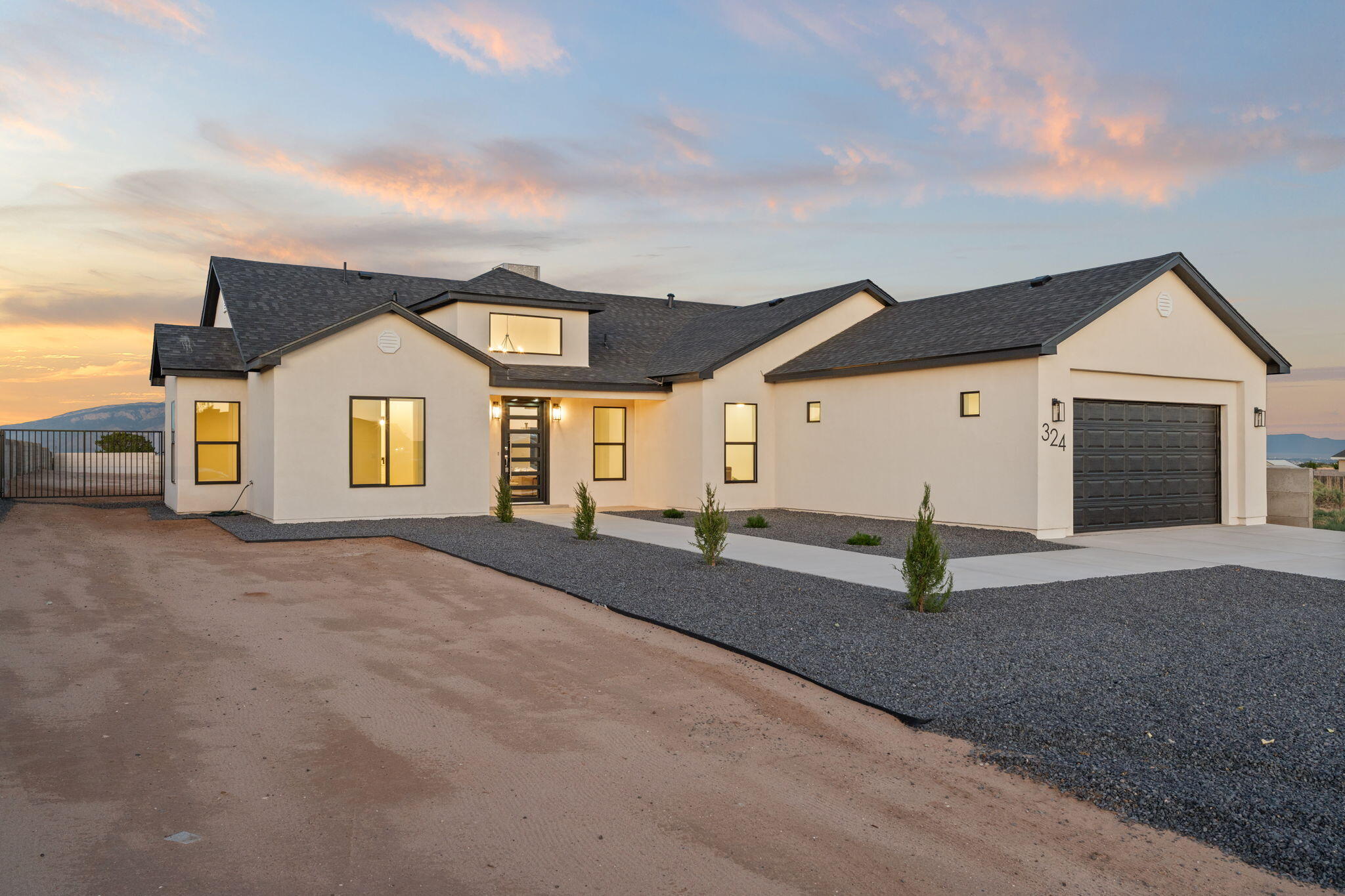 New Construction on 1/2 Acre with Mountain Views! Experience quality craftsmanship and modern elegance with soft tones in this beautifully designed 4-bedroom, 2.5-bath home. From custom handmade cabinetry to luxurious granite countertops, every detail showcases thoughtful design and top-tier finishes. The open, functional floor plan is enhanced by soaring ceilings that create a bright and spacious atmosphere. The primary suite offers a spa-like retreat with a stunning walk-in shower. An oversized laundry room and garage add extra convenience and storage. Enjoy privacy and security with cement wall fencing, while backyard access makes it easy to store toys, trailers, or enjoy outdoor adventures. A rare combination of style, space, and functionality--this home is a must-see!