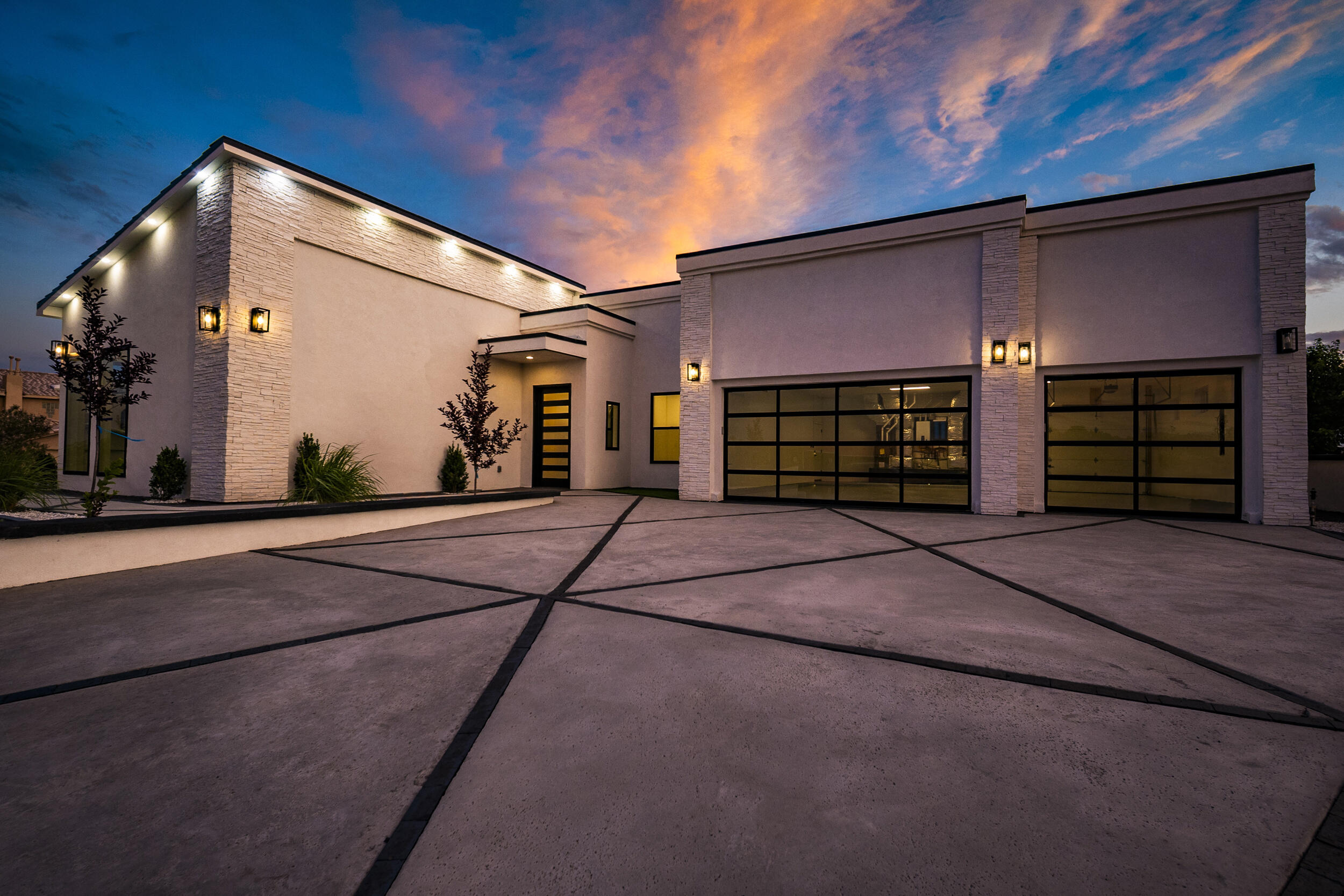 Modern contemporary elegance meets breathtaking mountain views in this 4 bed, 4 bath home in Rio Rancho's thriving growth corridor. Expansive windows fill the open-concept layout with natural light while capturing stunning Sandia views. The gourmet kitchen features sleek finishes and a large island, perfect for entertaining. Each bedroom offers privacy and style, including a luxurious owner's suite retreat. Enjoy outdoor living with room to relax and take in the vibrant New Mexico skies.
