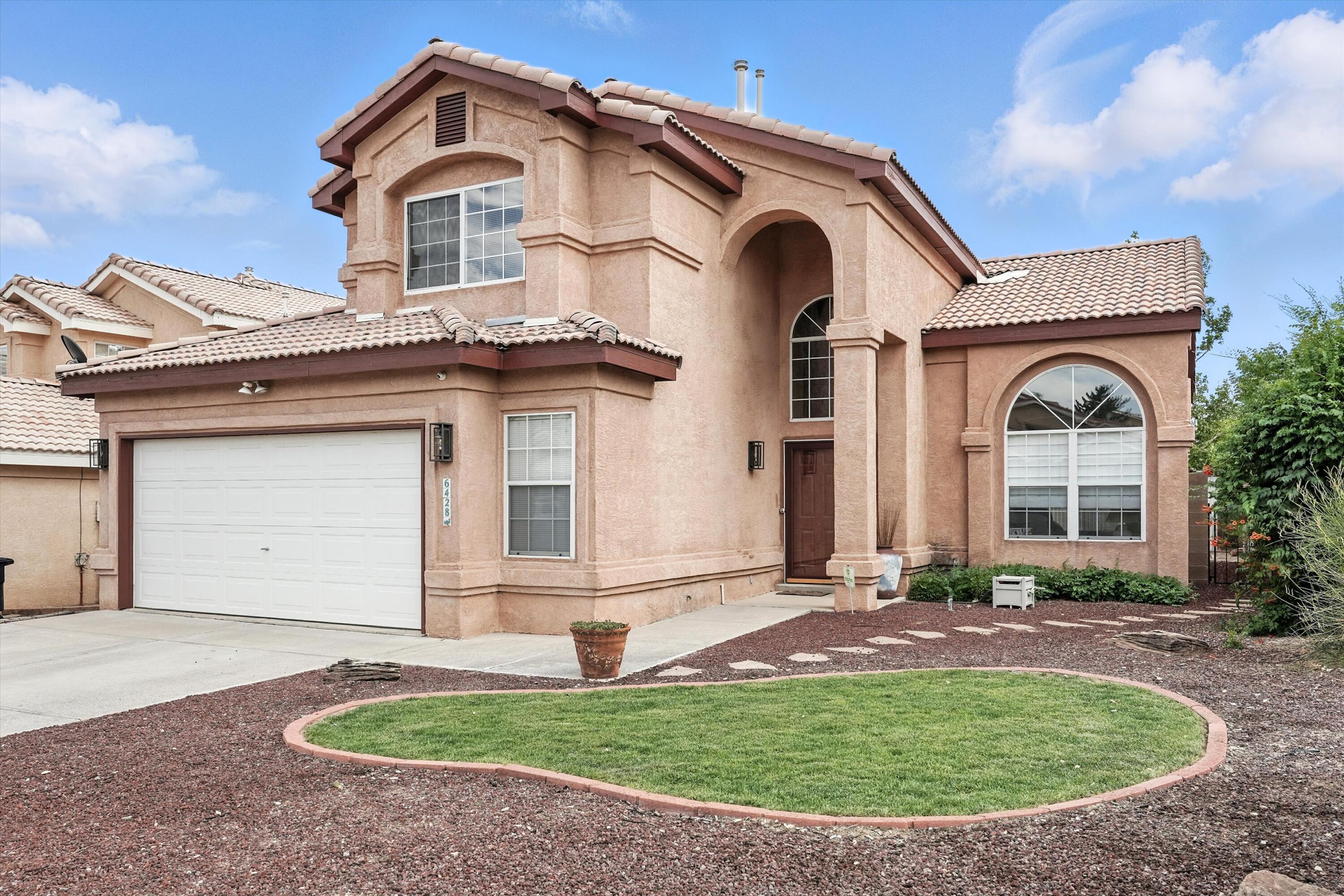 Welcome Home to this Gorgeous, well-cared-for 4-bed, 3-bath home in Taylor Ranch! The stunning entry features vaulted ceilings, a grand staircase, and large picture windows. Downstairs offers wood/tile floors, 2 living areas, a gas fireplace, formal dining, breakfast nook, and a guest bedroom with a fully remodeled bath. The updated kitchen includes rich wood cabinets, granite countertops, and tile backsplash. Upstairs are 3 spacious bedrooms, including a vaulted-ceiling primary suite with walk-in closet, balcony with mtn views and a spa-like bath with mosaic tile, walk-in shower, new vanity, and garden tub. Enjoy a large backyard with covered patio, and a lush lawn. Near Unser & Montano, Petroglyph trails, library, and parks and dog park.  Schedule your showing today!