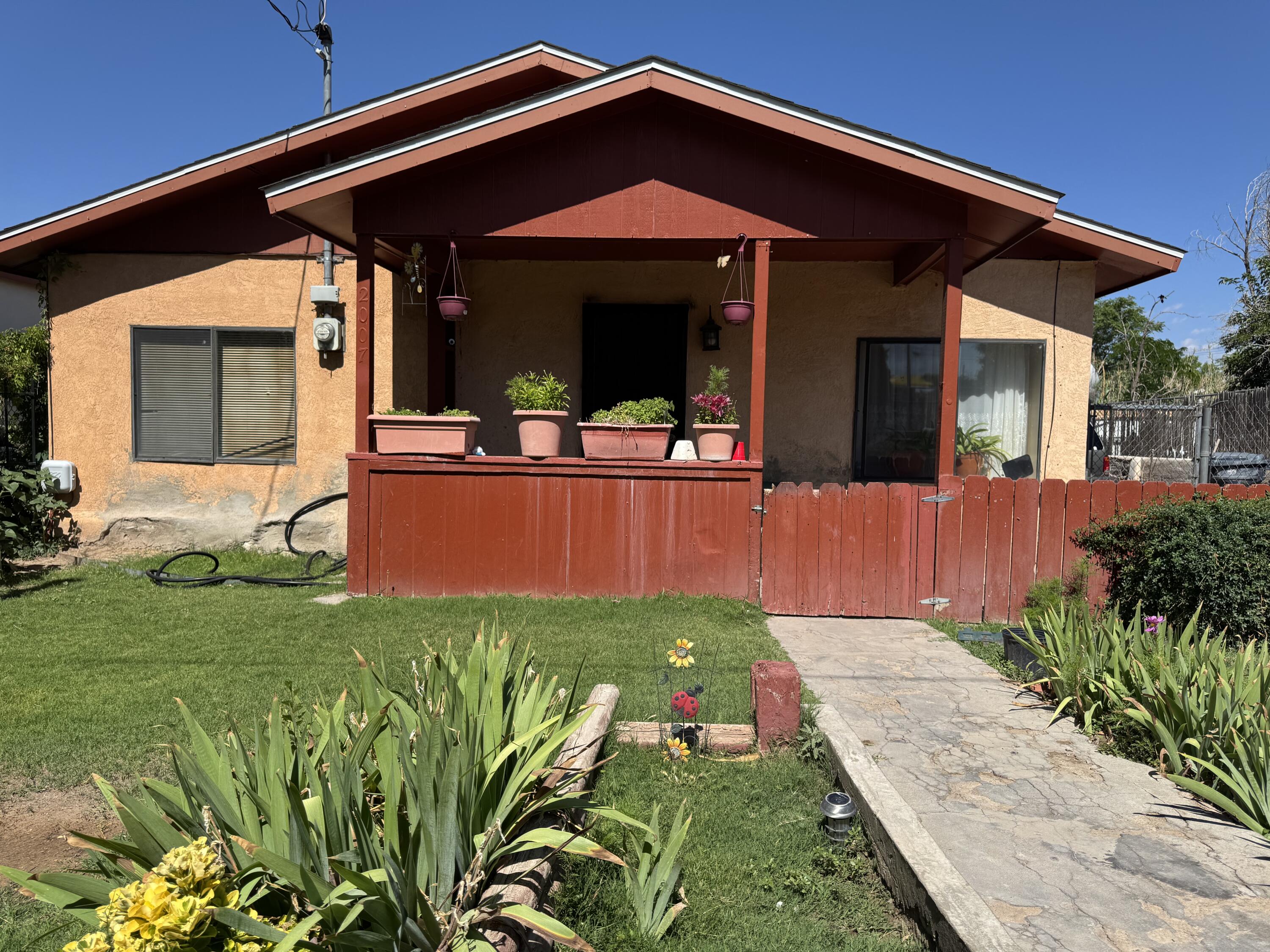 Come see this beautiful home located in the historic San Jose neighborhood! Owned by the same family since the 1930s, This property was thoughtfully remodeled in the 1980s and has been lovingly maintained ever since. This home features 3 spacious bedrooms, 1 tiled walk in shower , Separate laundry room, and  formal dining room, Interior finishes include:Laminate flooring in the living room and third bedroom, tile flooring in the dining room, bathroom, hallway, and kitchen Carpet in the primary bedroom and second bedroom. Enjoy central heating and cooling for year-round comfort, back yard access with a secured chain link fence giving convenient access and added security. This home is located near downtown, easy access to KAFB/SNL, and minutes to freeway. Don't miss out and schedule a tour.